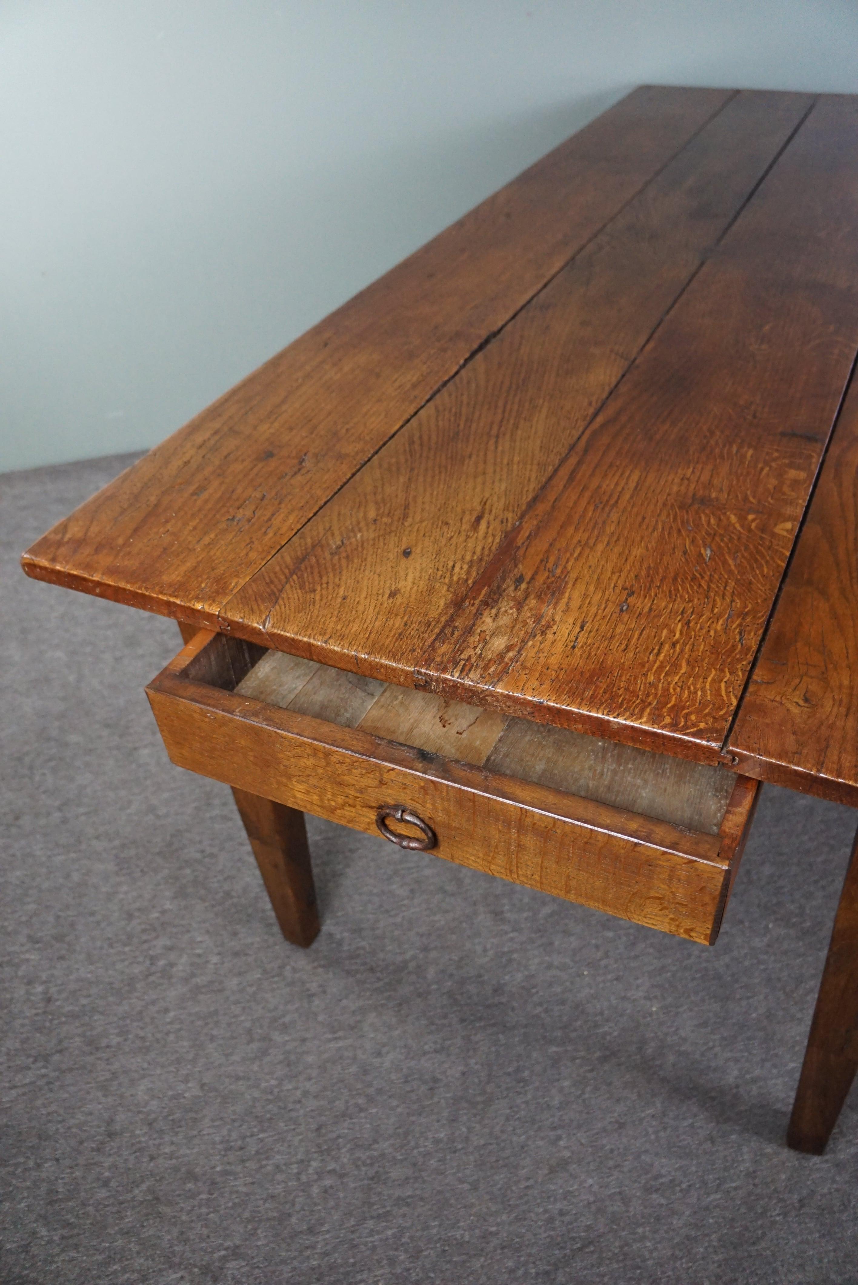French dining table dating back to the early 19th century with warm colors For Sale 3