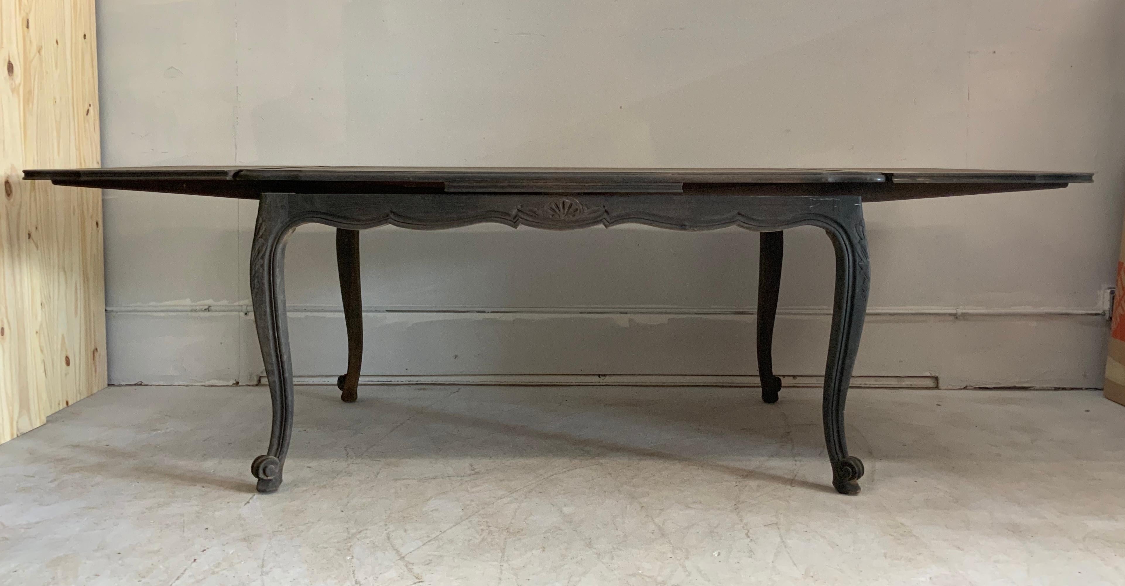French dining table Louis XV style, with special finish in grey made by us, with a parquet top and in cherrywood. This table has 2 extensions of 18.5