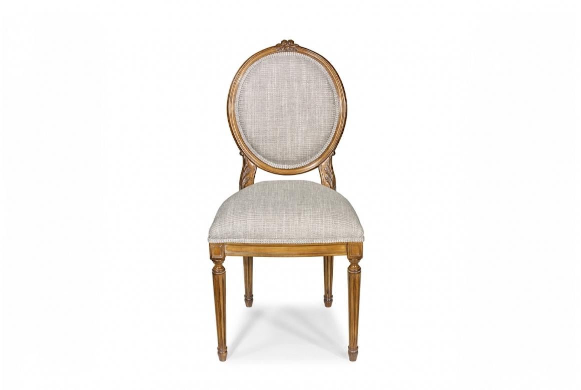 A stunning French Dior dining chair, 20th century.

The Dior dining chair is shown in cherrywood with a Leblon finish. Note the hand carved detailing on the back and the fluted en carquois legs. 

Handcrafted in cherrywood, oak, walnut, mahogany