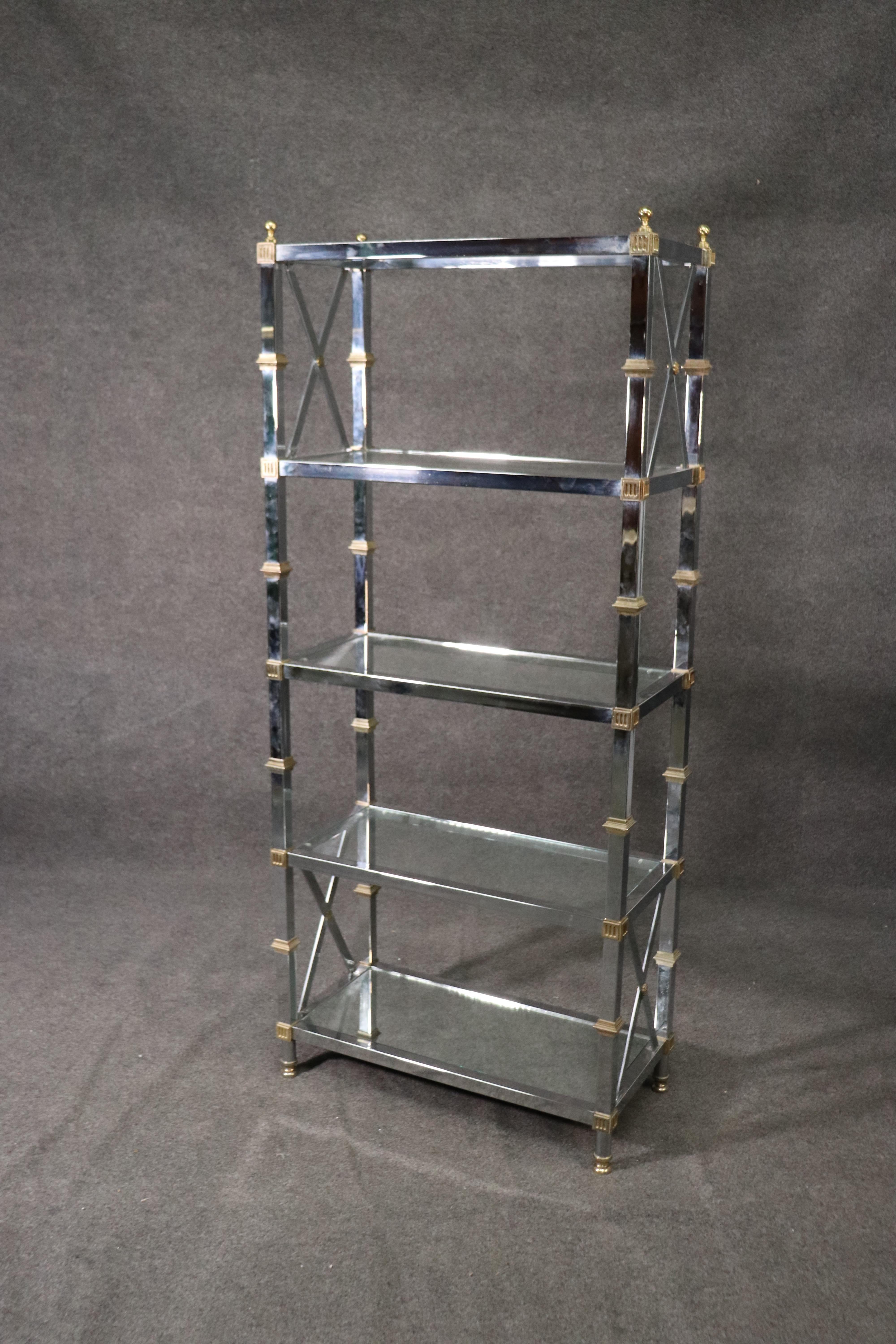 This is a beautiful chrome and brass étagère in the Directoire style. The étagère is in good condition with minor signs of age and wear. The étagère measures: 72 tall x 31 wide x 16 deep. Dates to the late 1960s or early 1970s era.