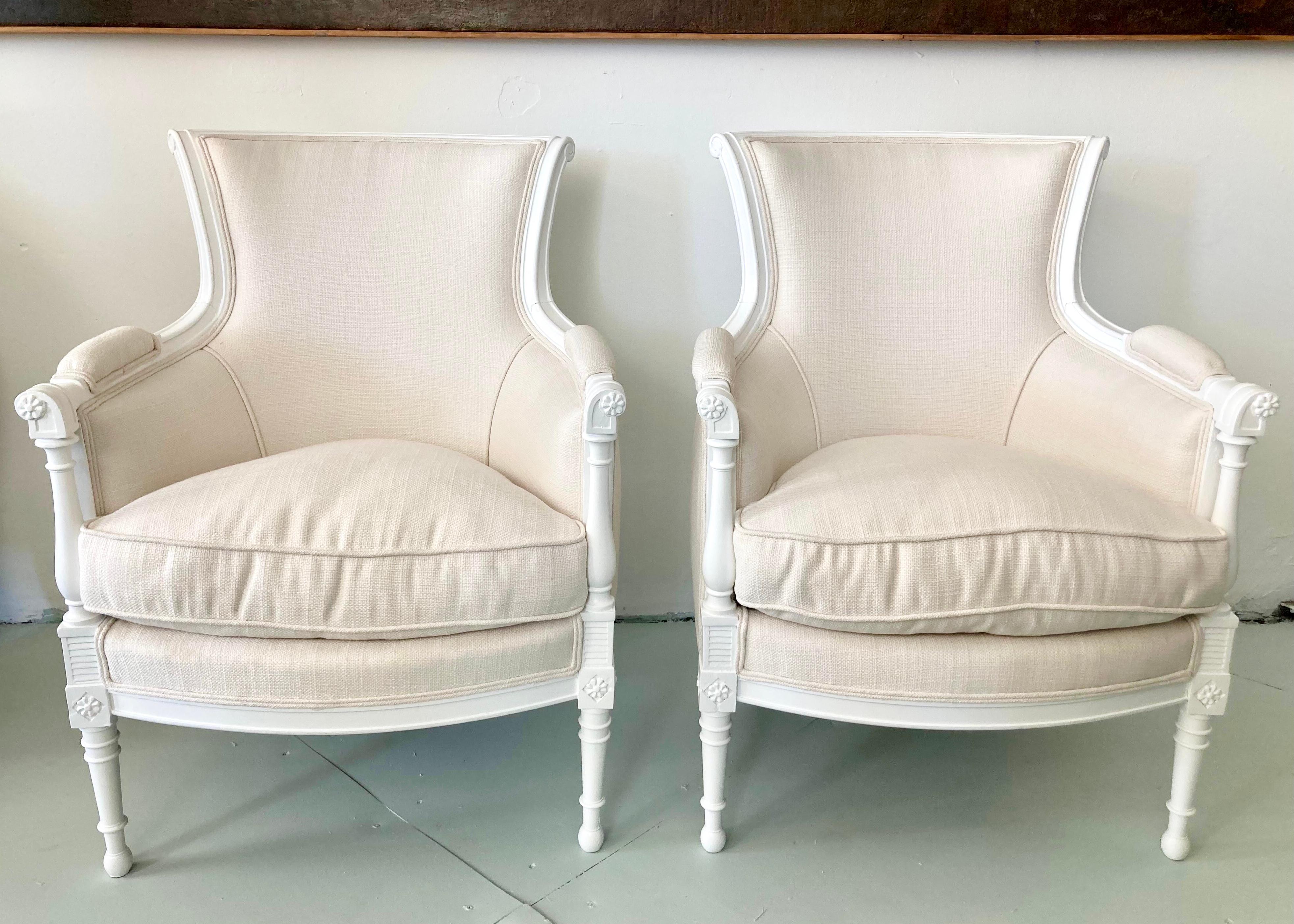 Fabulous pair of French directoire Bergere chair freshly lacquered in white finish. New Todd Hase upholstery. New Todd Hase Hight Performance Off White textiles .Add some French Style and architecture to your eclectic interiors.