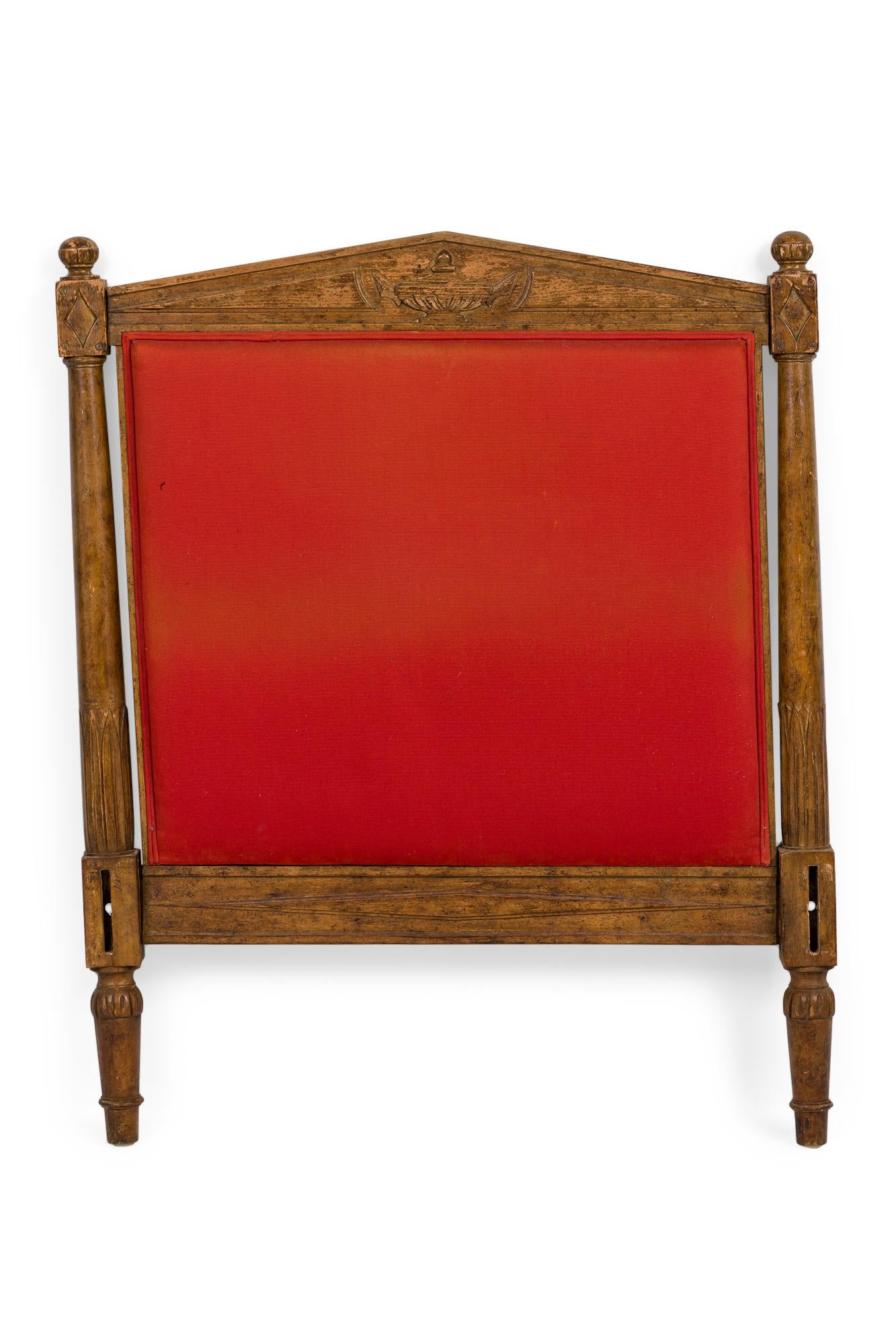 French Directoire daybed with a carved wooden frame a finial top on each end and an urn engraved in to the frame of the bed