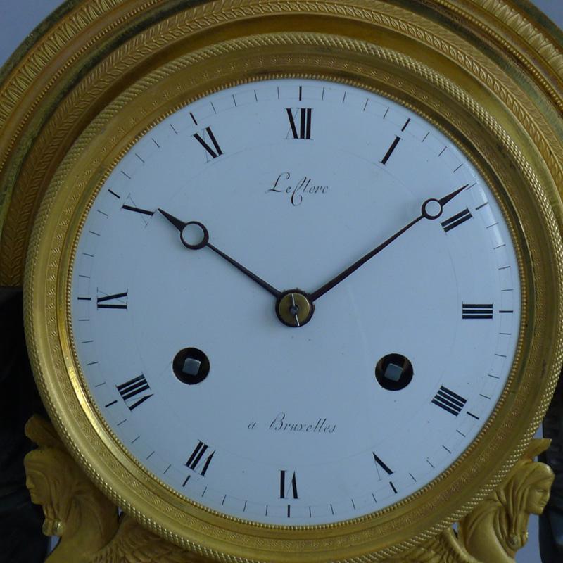 Beautiful antique French Directoire period Egyptian or Gout d'Egypt ormolu and patinated bronze mantel clock. Superb quality and condition of the entirely original fire gilt ormolu. Egyptian headed, patinated bronze terms with fine applied ormolu