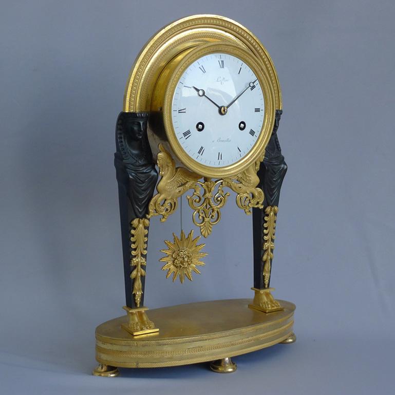 Patinated French Directoire Egyptian Style Mantel Clock Signed Leclerc For Sale