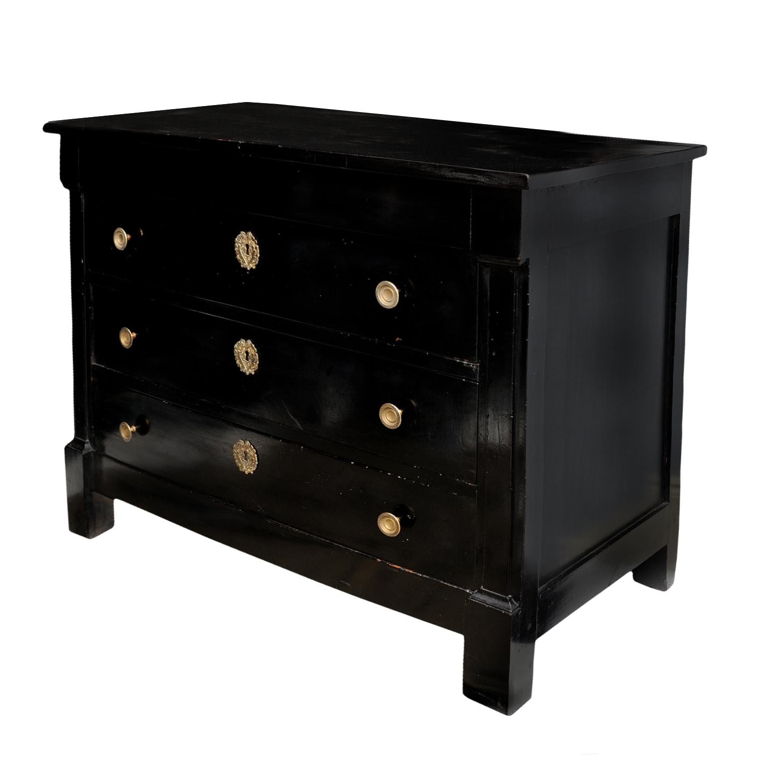 This is a most handsome ?French early 19th century Directoire/Empire period ebonised three-drawer commode of generous proportions, circa 1810.