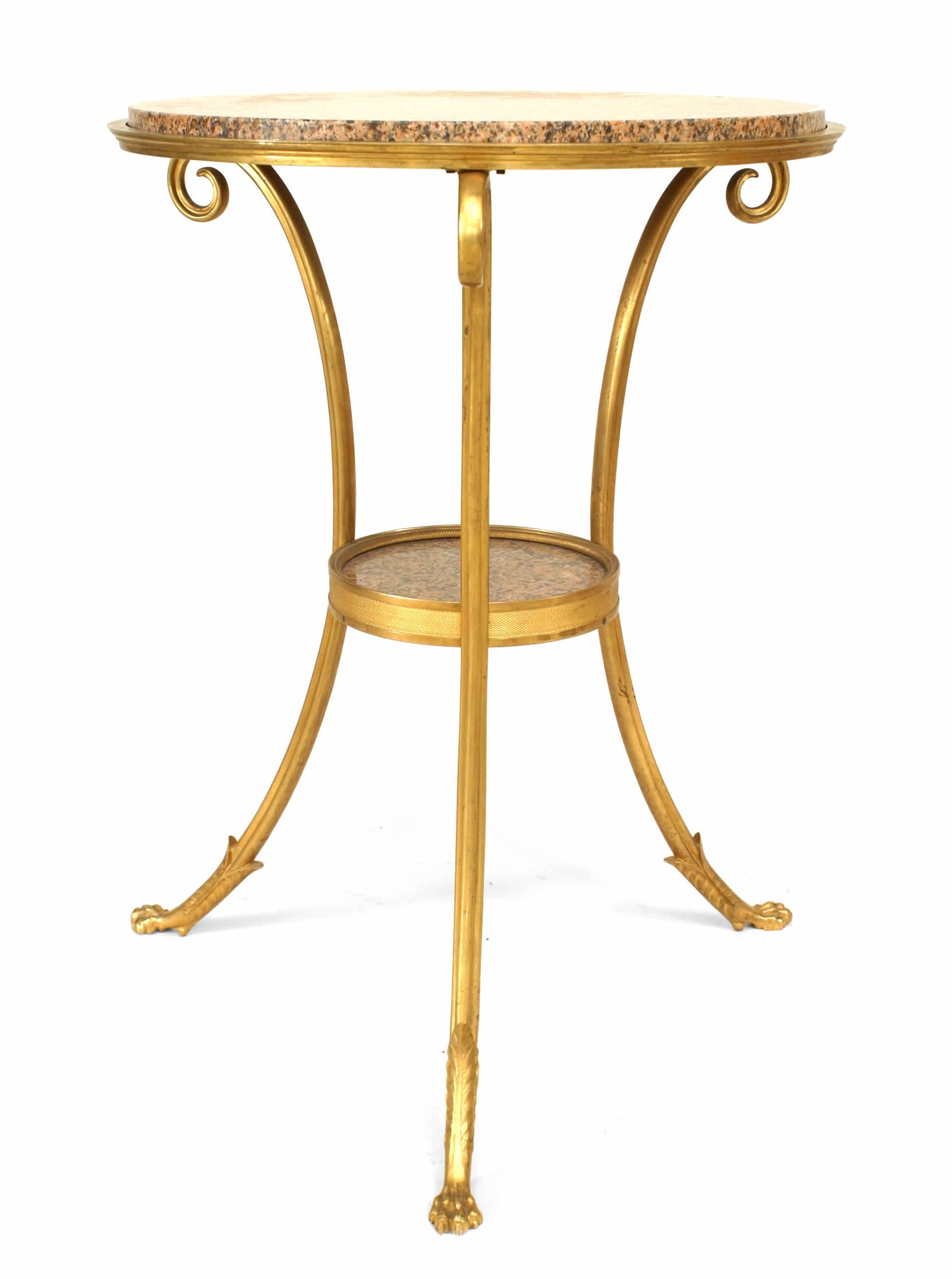 French Directoire-style (20th century) gilt bronze end table with 3 scroll legs and inset round pink and black speckled marble top and shelf.