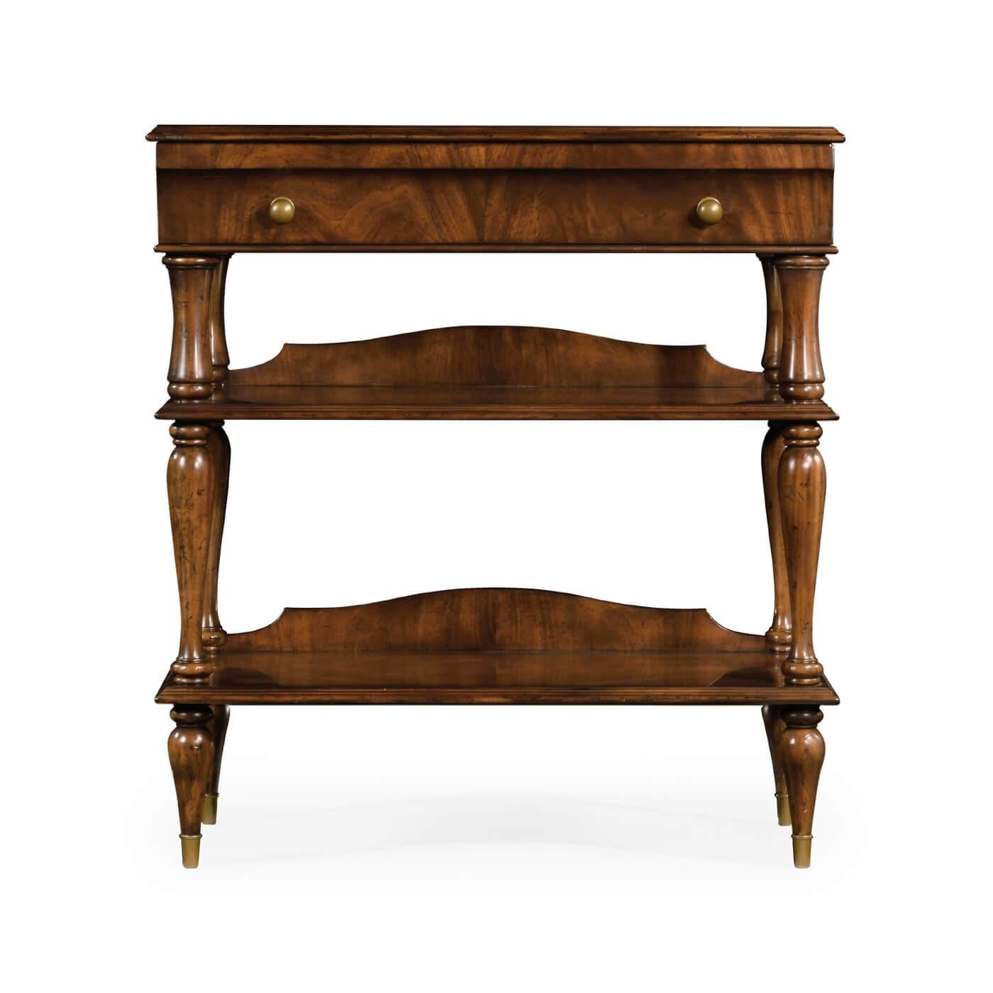 French Directoire style mahogany nightstand with figured mahogany veneers, a molded edge above a single long drawer, two lower shelves with molded edges and supported by shaped and turned legs on turned taupee feet with brass knob handles and