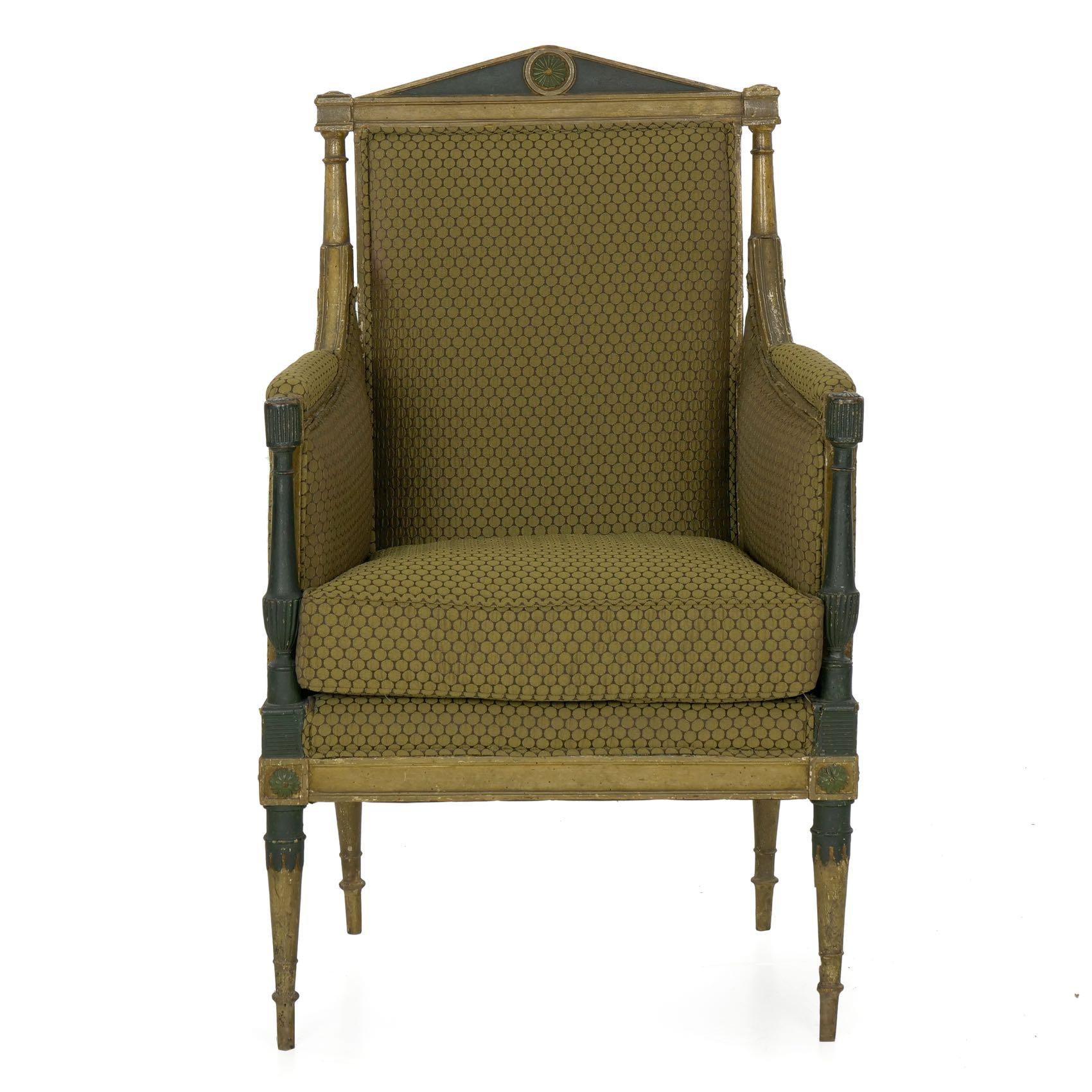 A fine lounging chair from the first half of the 19th century, the chair is notable for its gorgeous early worn polychromed surface. The charcoal and beige ground paints are highlighted with dark green painted embellishments, all being quite old and