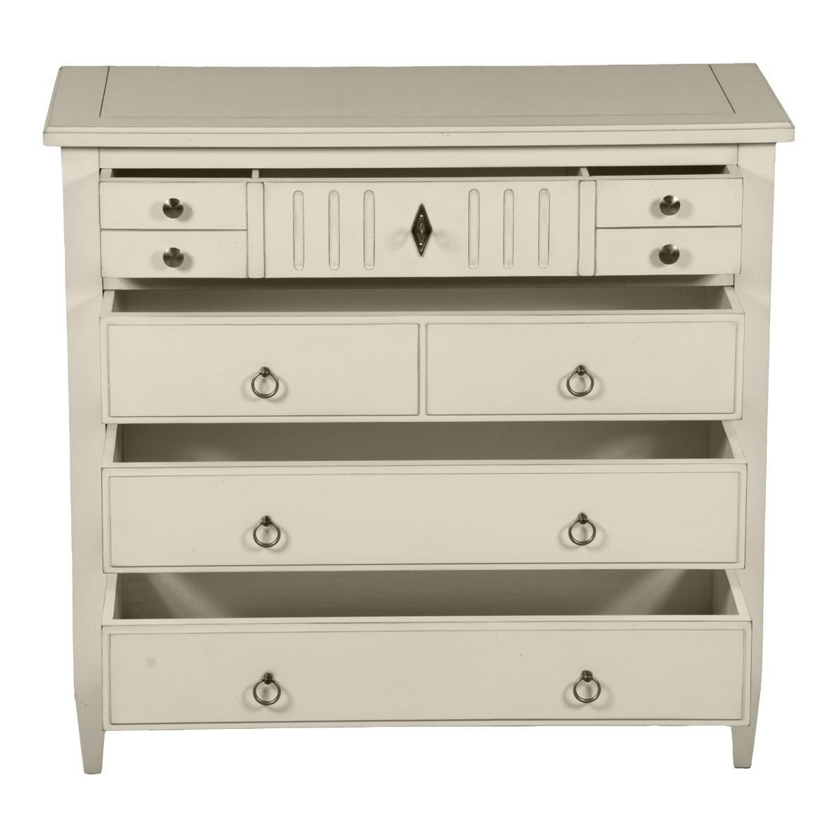 This 4 drawer chest is a handmade reproduction of the French Directoire style at the end of the 18th century. This period is remarkable for its straight, classical and timeless lines. This chest of draws is painted with a French Countryside touch