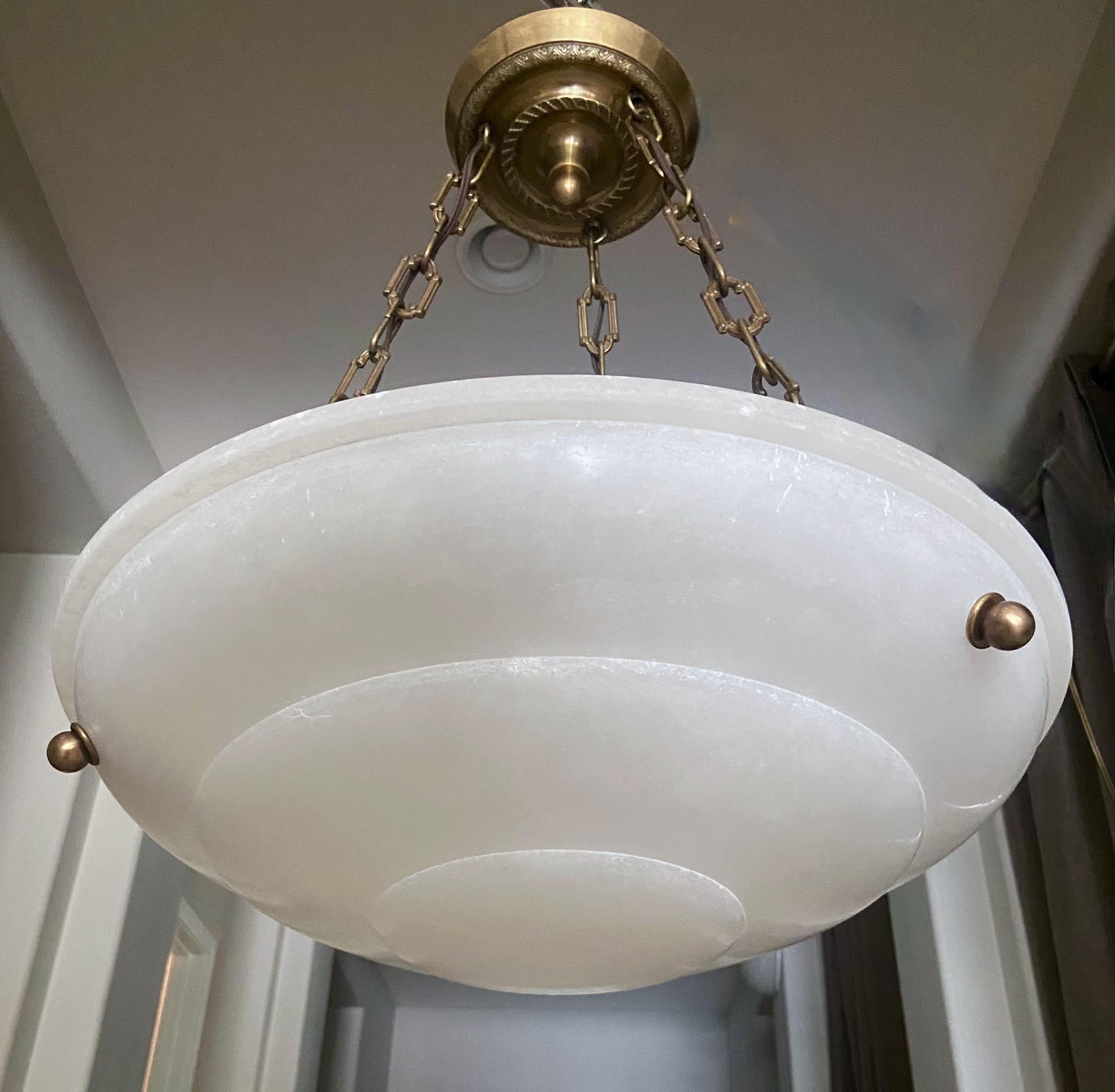 White alabaster pendant light or chandelier with aged patinated brass fittings in the Directoire style. Newly wired for US, fixture uses three candelabra size bulbs

Measures: Alabaster is 18.75