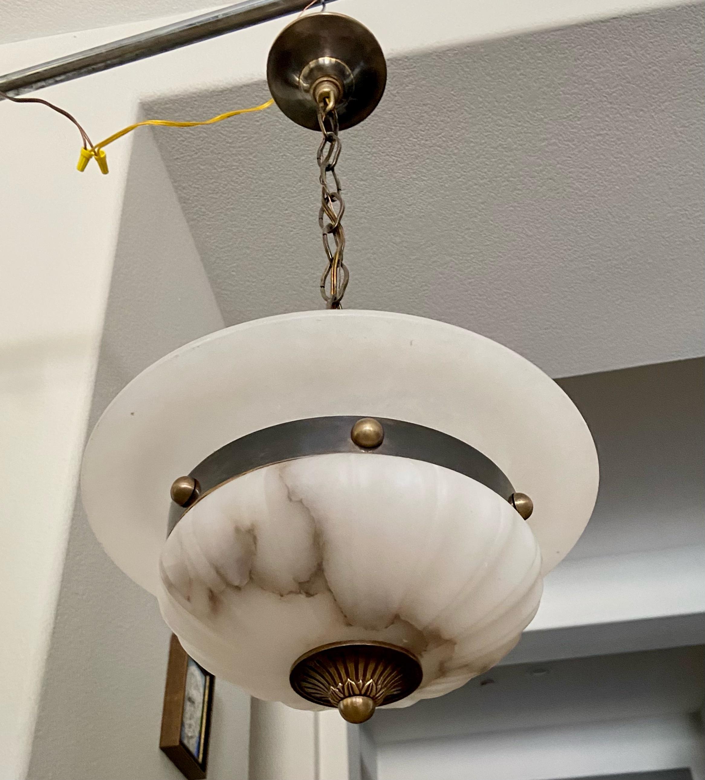 Alabaster pendant light (or smaller scale chandelier) with aged patinated brass fittings in the Directoire style. The alabaster is has lots of natural veining. Newly wired for US, fixture uses two candelabra 