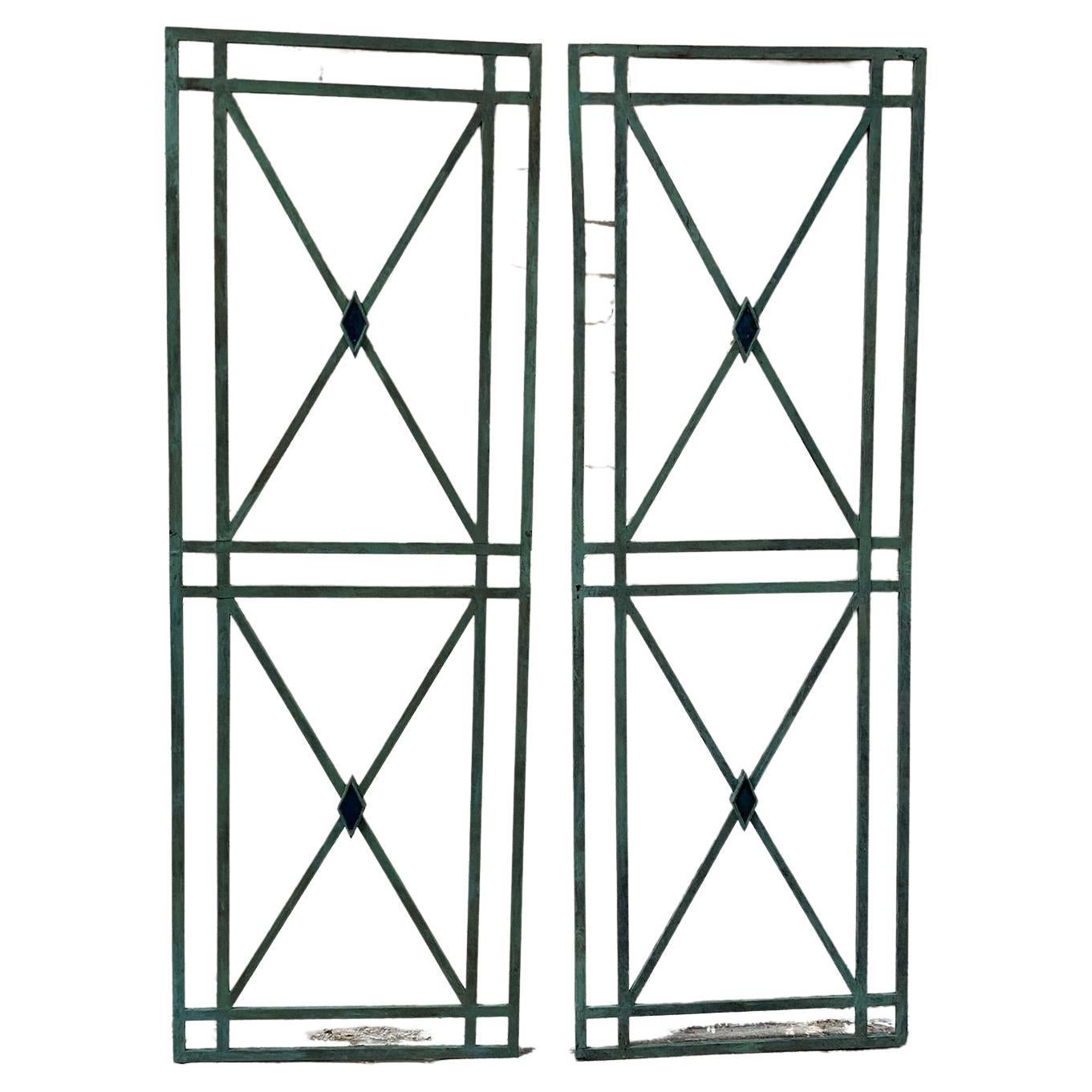 French Directoire style bronze wall mounted panels, the classic X-frame panels with central diamond made from molten enamel. 

So stylish, these panels can be wall mounted to give classical architectural feature to any room.

The panels have