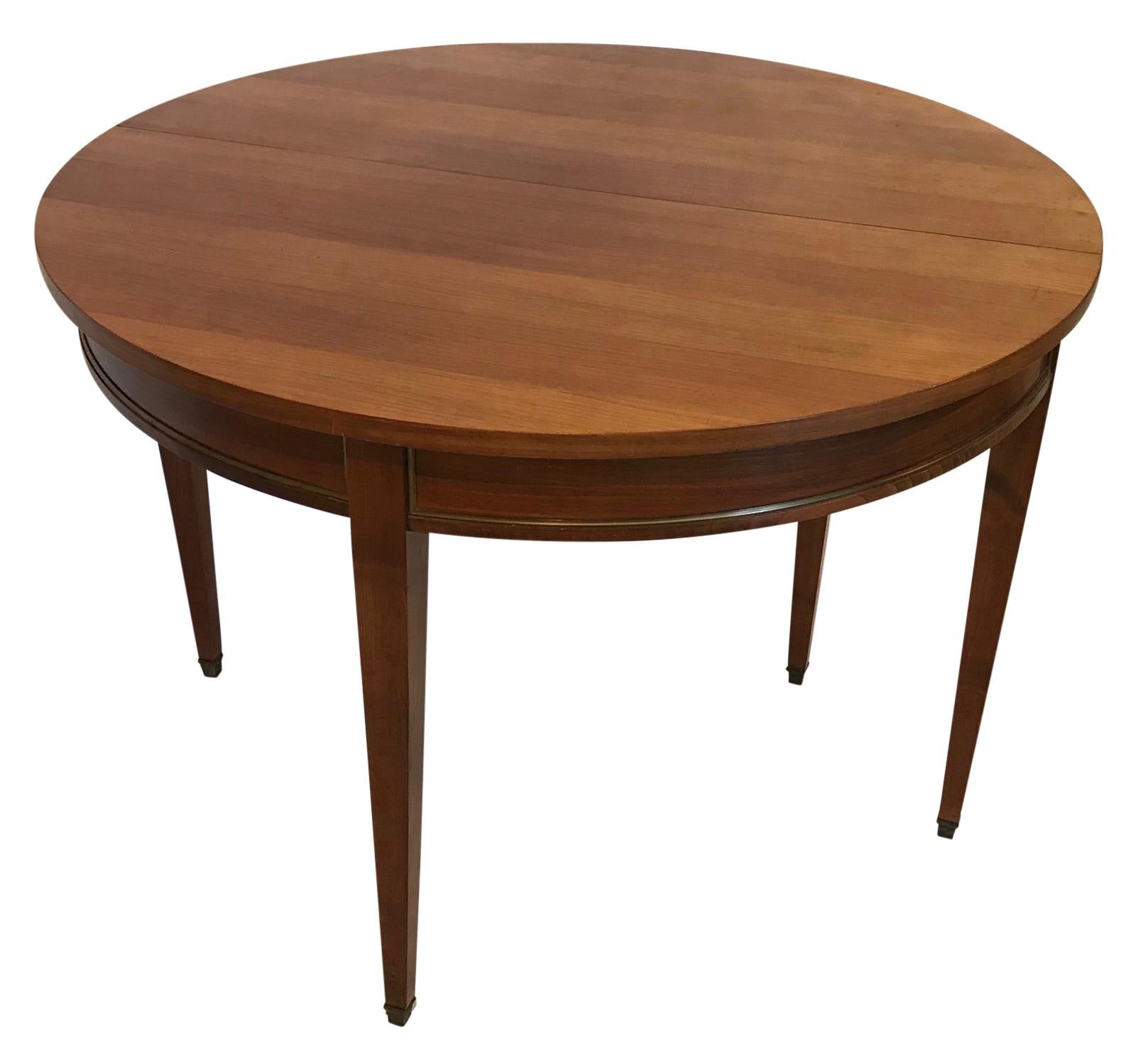 Custom made in France about 30 years ago, Directoire style cherrywood demilune table with brass accent.
When the table is open the diameter is 43.5 inches. Height of the table when open is 29.5 inches
Beautiful quality.
Last quarter of the 20th