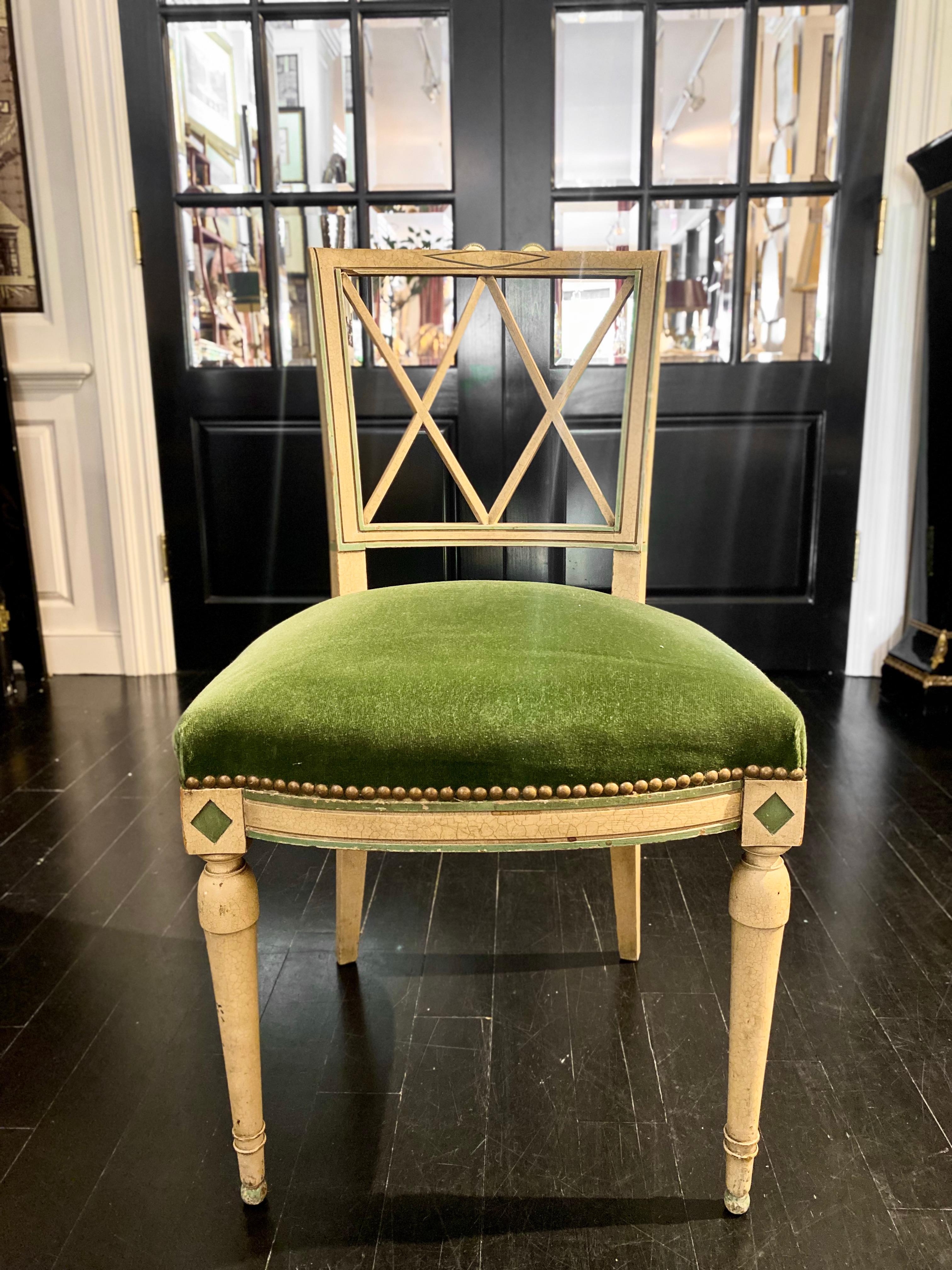 French Directoire Style chair, upholstered in green velvet. 

The Directoire or Directory style takes its name from the period 1795–1799 when France was ruled by a government of Directors – the Directory. Directory style was not so much an