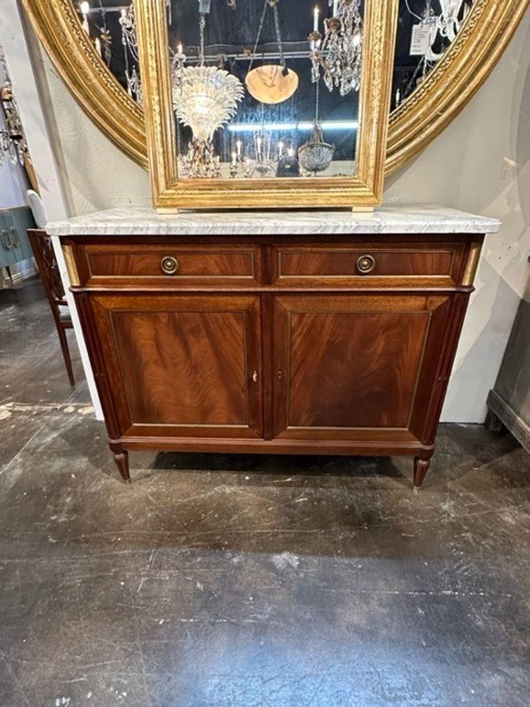 Handsome French Directoire style mahogany and brass trim server. Very nice clean lines and beautiful wood.  Lovely marble top as well. Pretty!!