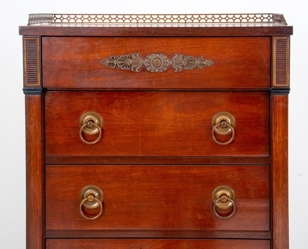 French Directoire Style mahogany semainier or tall dresser raised on square tapered feet, having seven drawers with gilt metal handles.

Dimensions: 56.5