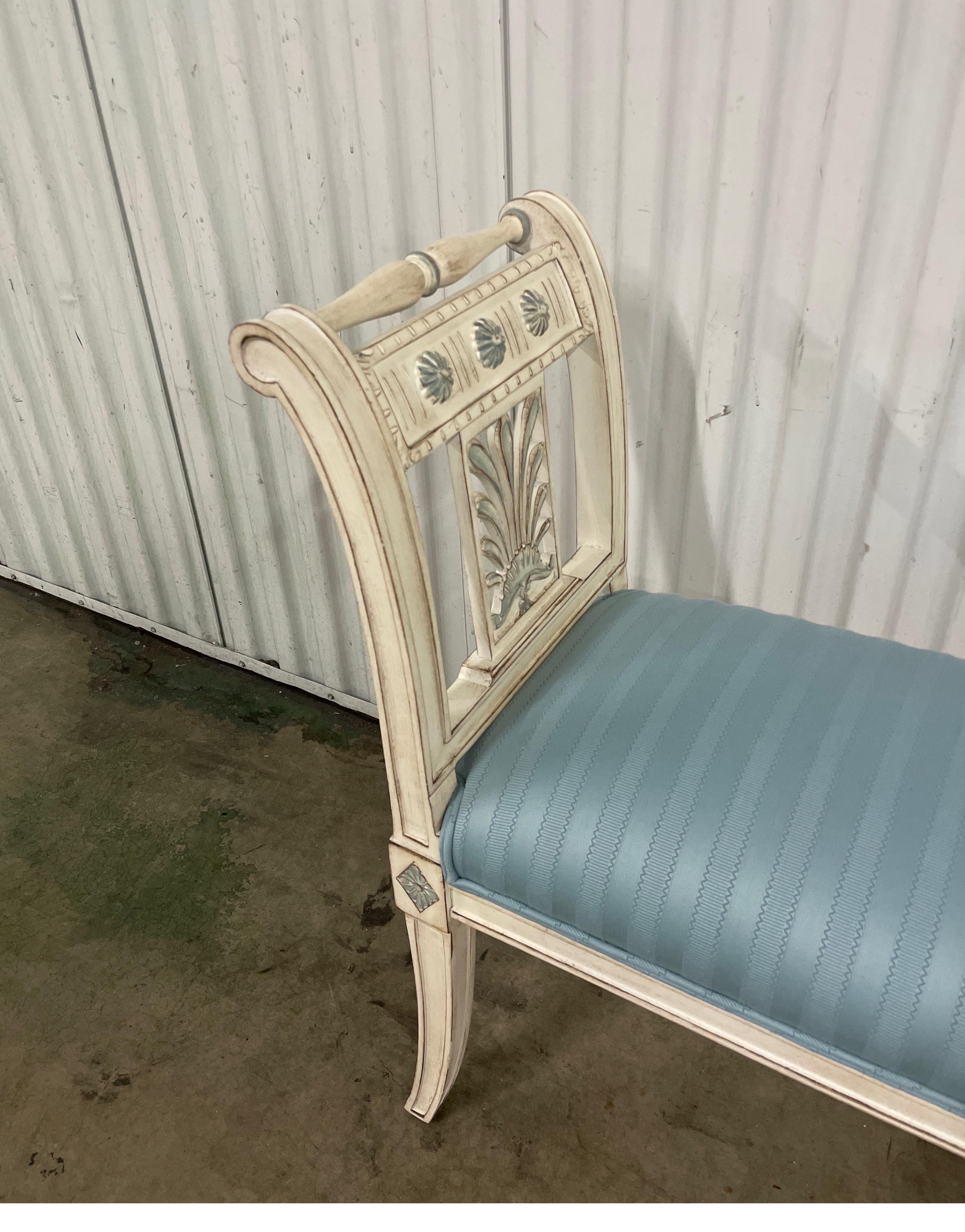 Lovely painted Directoire style French window bench. Nicely carved and painted bench with light blue upholstered seat. Very versatile.
