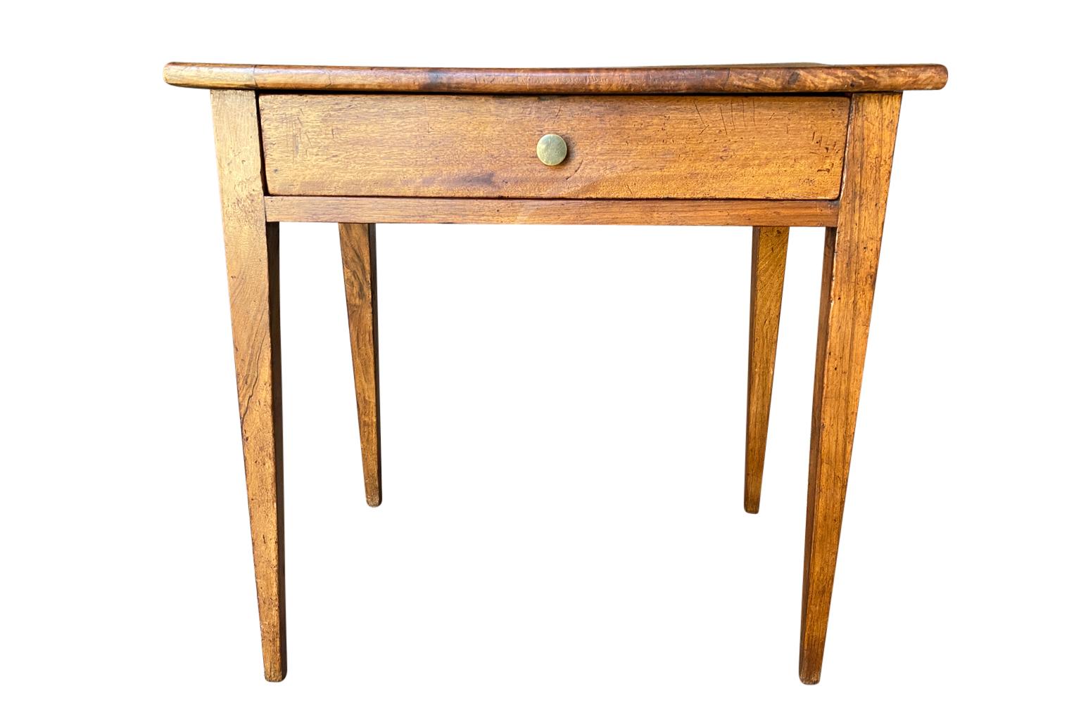 A 19th century Directoire style side table from the South of France. Soundly constructed from walnut with a single drawer and tapered legs.