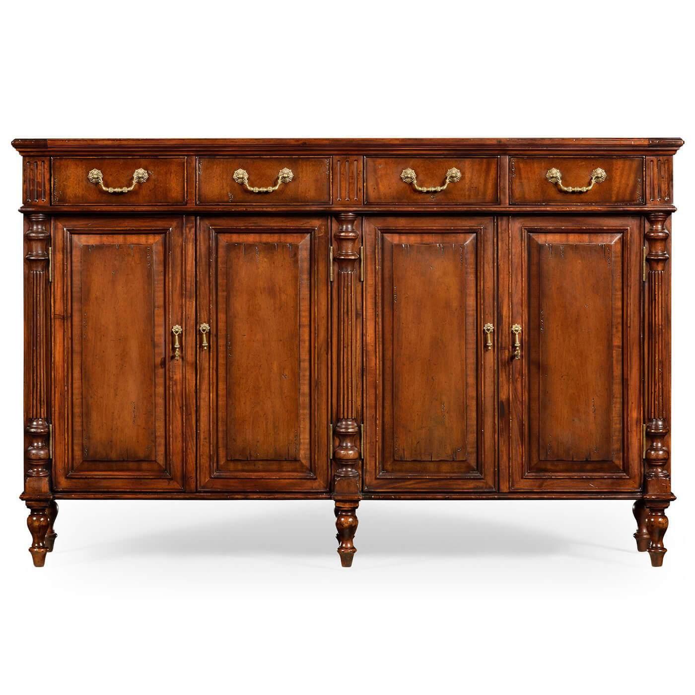 French Directoire style distressed walnut buffet sideboard with four small drawers above two double door cabinets. With half round and reeded column styles above turned baluster form legs.

Dimensions: 58.25