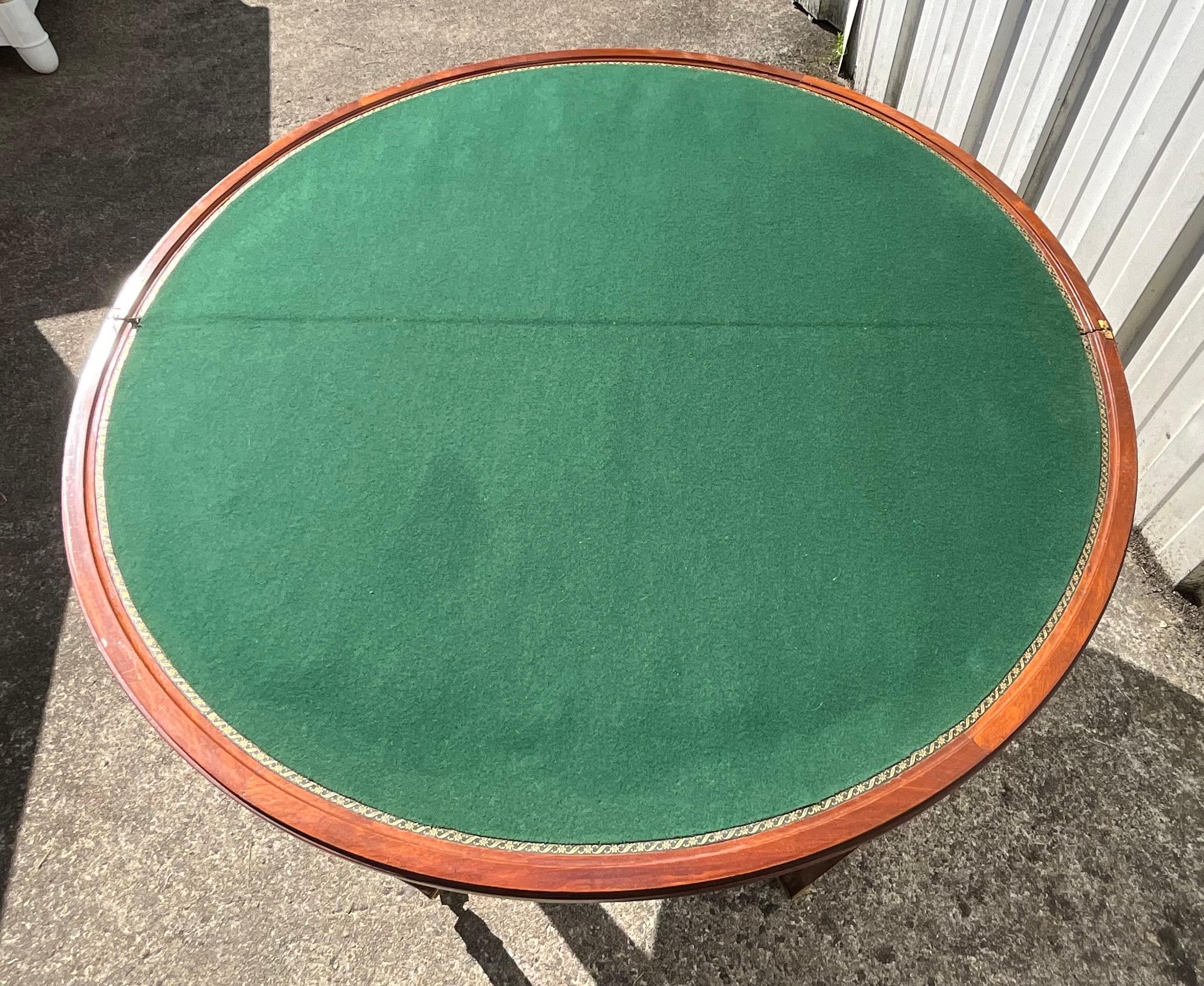 French Directoire Transformable Games Table, Late 18th – Early 19th Century

This French Directoire-style table embodies the elegance and ingenuity of late 18th-century craftsmanship. Made from fine mahogany, it rests on five tapered legs ending in