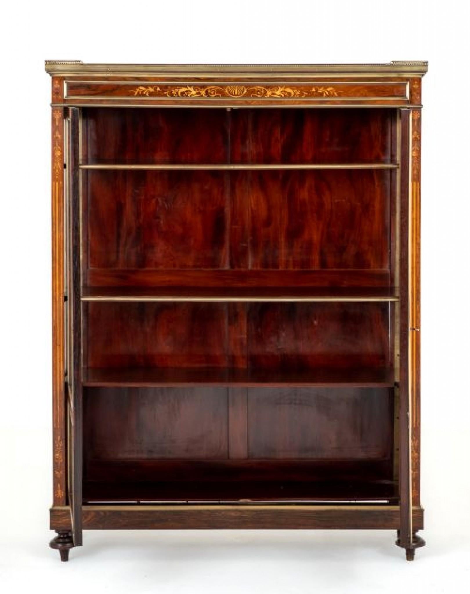 Pretty french rosewood inlaid side cabinet.
circa 1860
This cabinet is raised upon turned bun feet.
Featuring 2 doors.
The lower panels of the doors featuring pretty marquetry inlays.
The doors open to reveal adjustable shelving.
The frieze