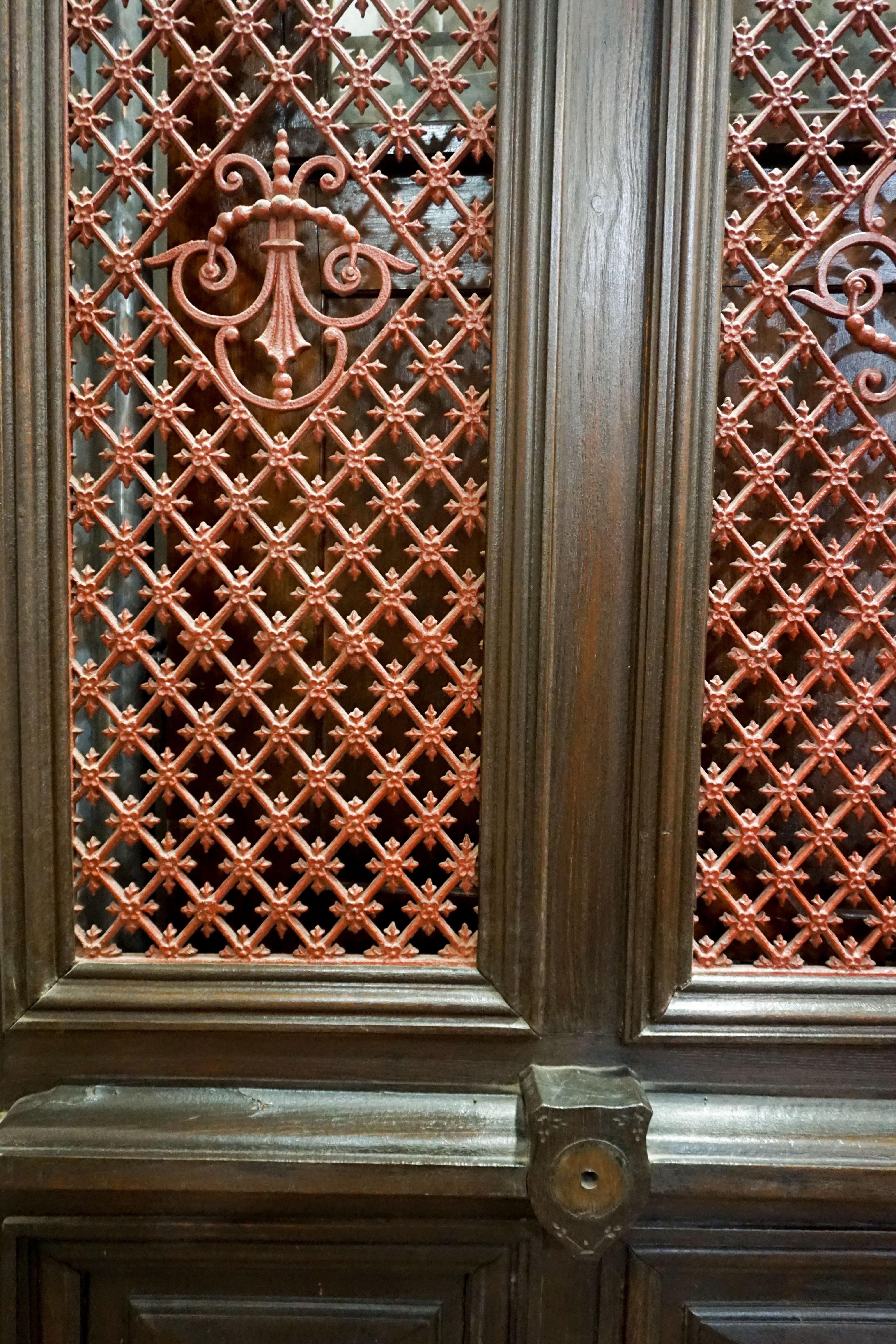 French oak door with painted iron lattice work over twin windows.

Origin: France, circa 1860

Measurements: 44