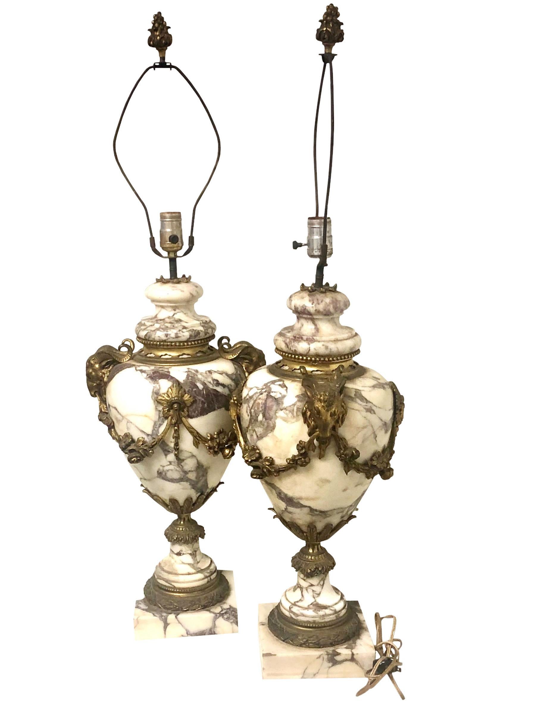 Very large pair of French dore bronze and marble castellettes converted into lamps. Cord and socket are in good condition maybe from the 60s the castellettes are late 19th century and the finials on harp are original to the castellettes. They just