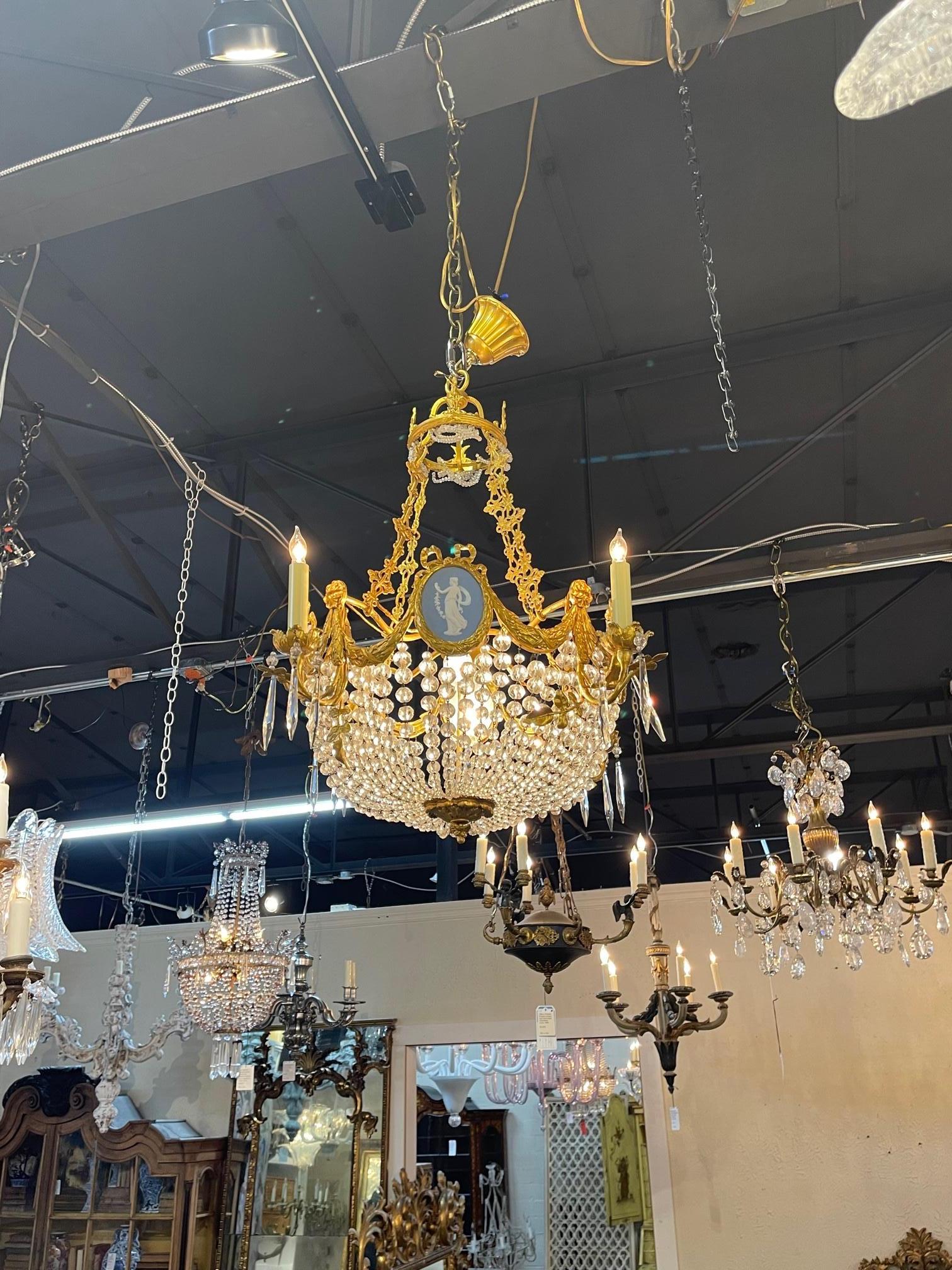 Fine quality 19th century French bronze and wedgwood plaque basket chandelier, Circa 1870. The chandelier has been professionally re-wired, cleaned and is ready to hang. Includes matching chain and canopy. Sure to make a statement.