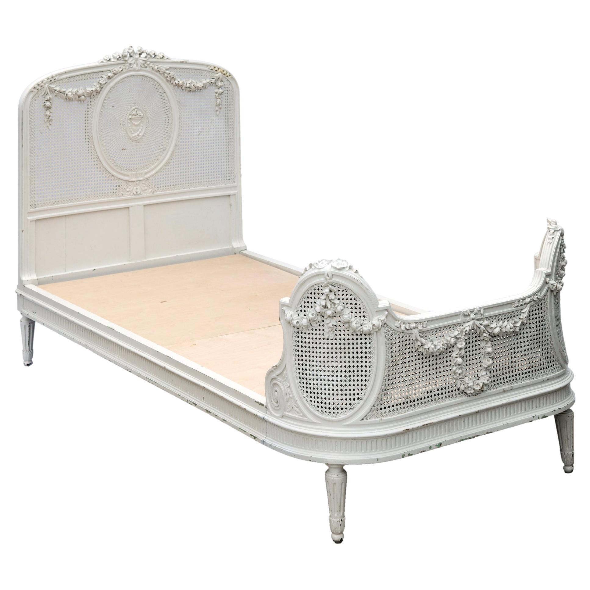 French Double Caned & Carved White Twin Bed with Rose Swags For Sale