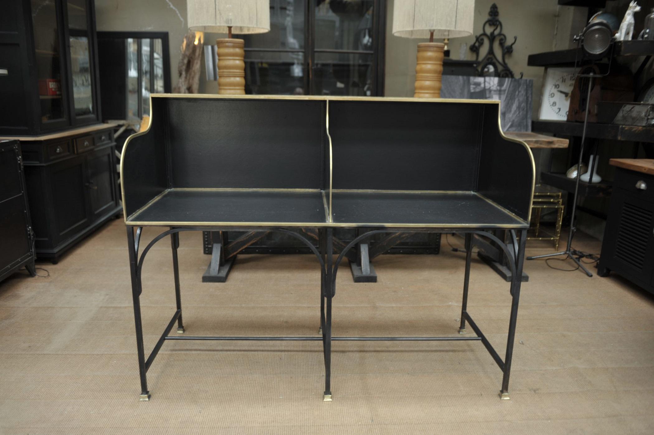Iron double seat metal and brass bank desk counter circa 1910 original black color. Height of working top 76 cm 29.92 inches.
 
