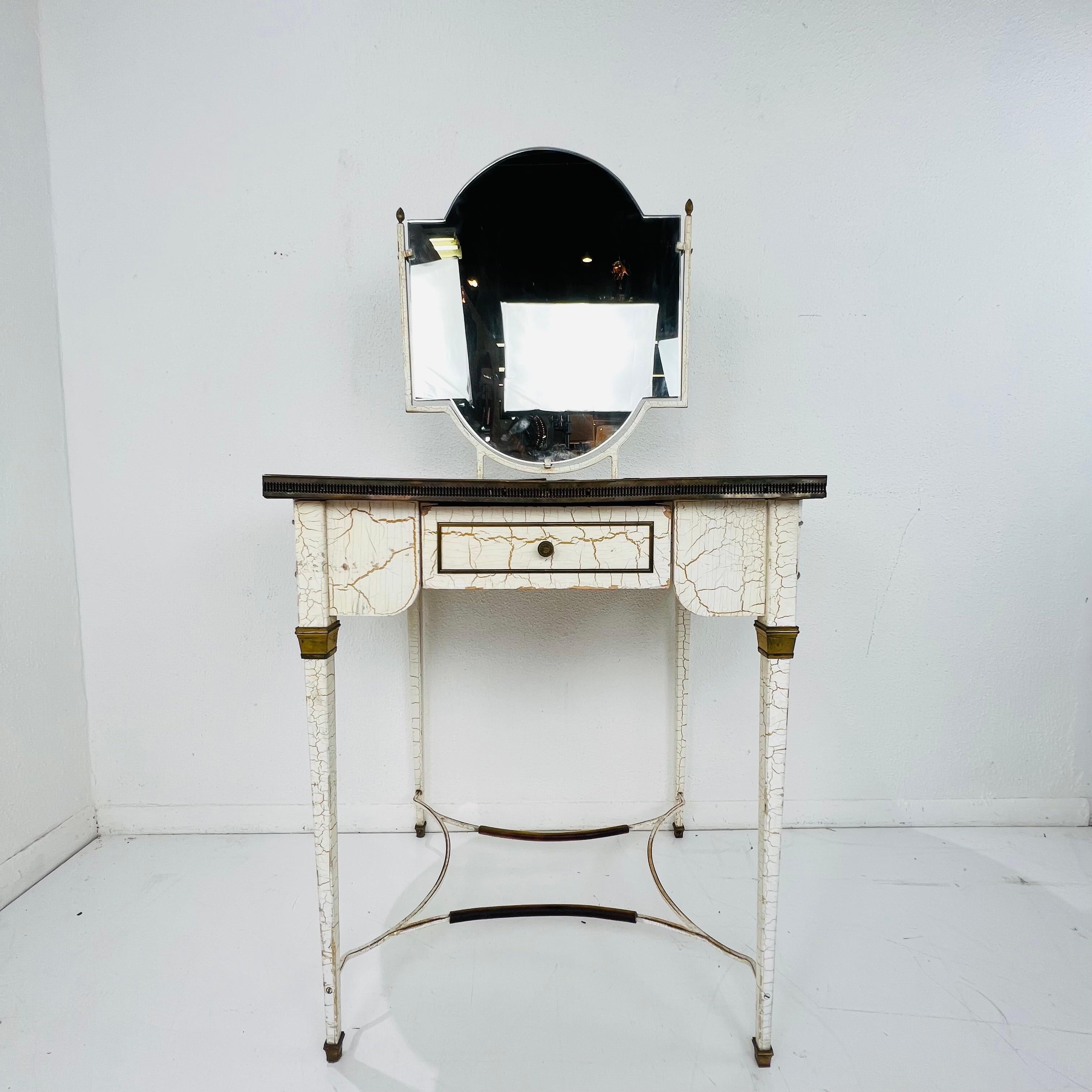 Stunning Louis XVI style dressing table/vanity. Featuring a double sided mirror and painted metal legs, this dressing table is a stunning addition to any bedroom, dressing room or bathroom. Top features French Provential scenery under antique