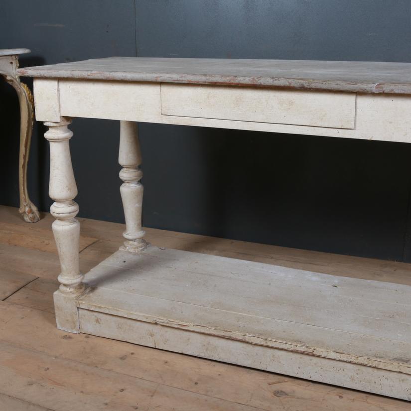 Good 19th century French painted two-drawer drapers table. Awaiting handles, 1880.

Dimensions:
90 inches (229 cms) wide
22 inches (56 cms) deep
33.5 inches (85 cms) high.

 
