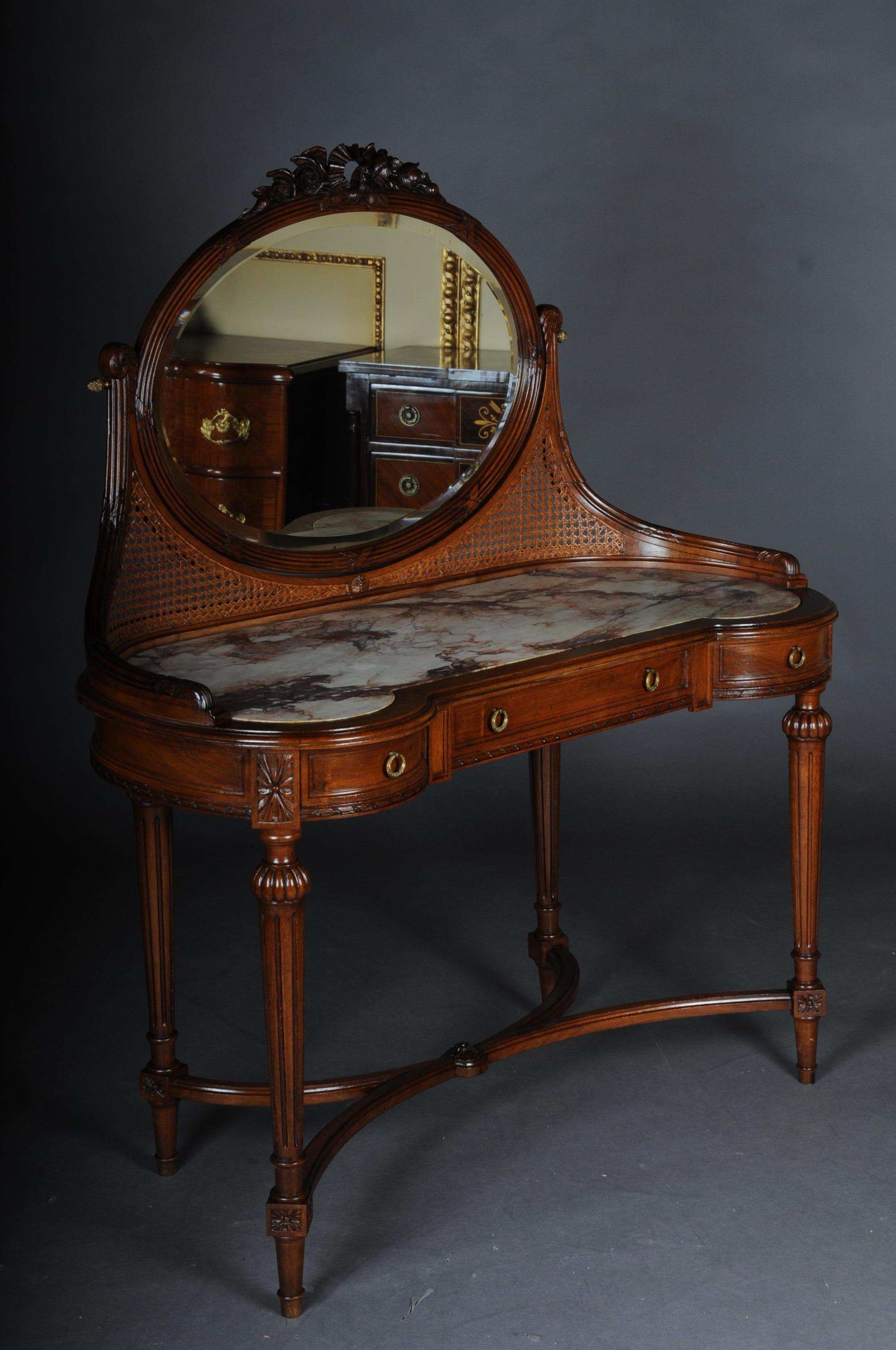 French dressing table / vanity table with mirror classicism

Solid wood hand-carved with rich neoclassical elements. France 19th century
Inlaid mottled marble cover plate. Sides box with 3 front bays. Adjustable, oval mirror with framed, profiled