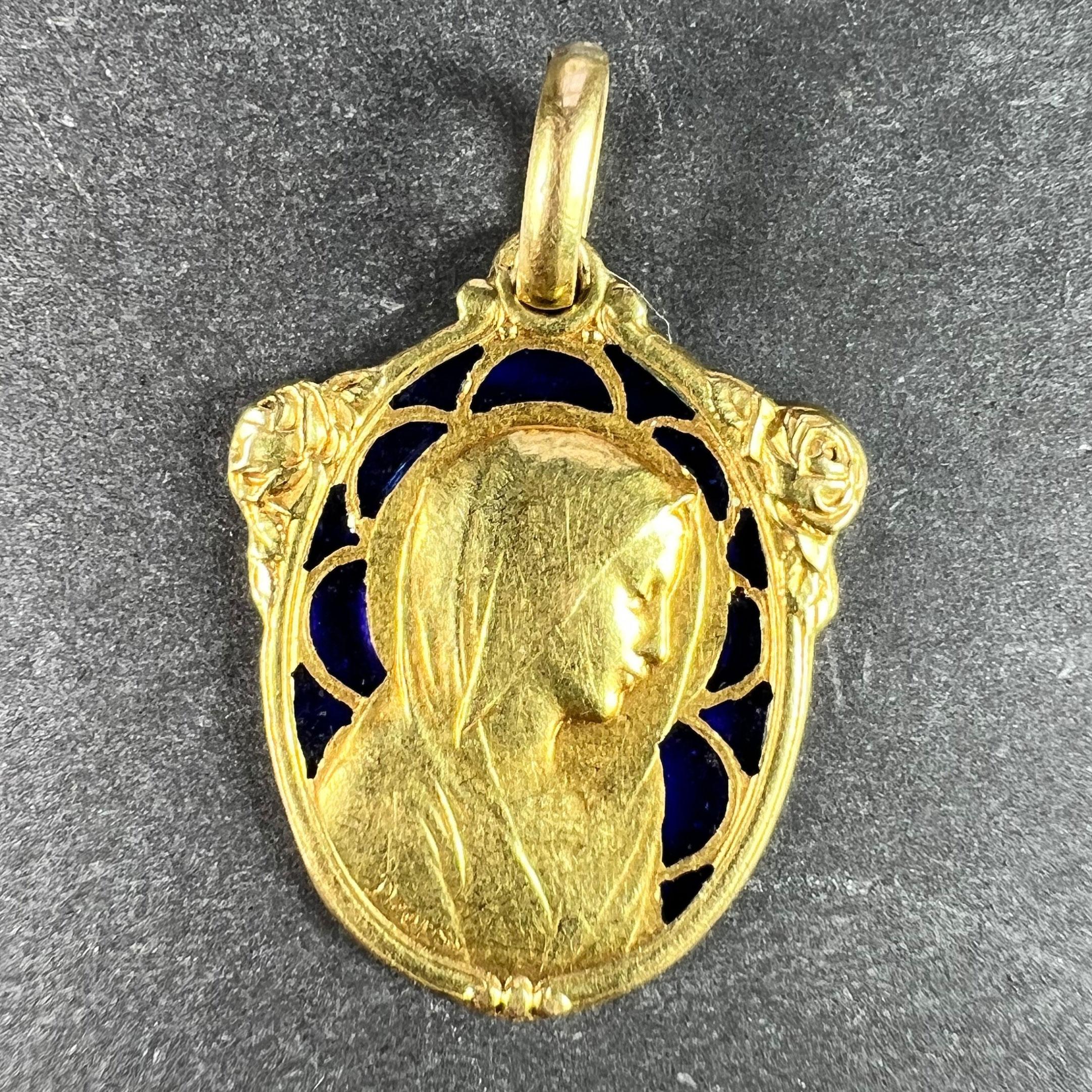 A French 18 karat (18K) yellow gold charm pendant set with plique a jour blue enamel designed as the Virgin Mary with a motif of roses. Signed Dropsy. Engraved to the reverse with a monogram for MB and the date 21 Mai 1933. Stamped with the eagle
