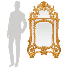 Miroir français en bois doré du début du XVIIIe siècle de la période Régence