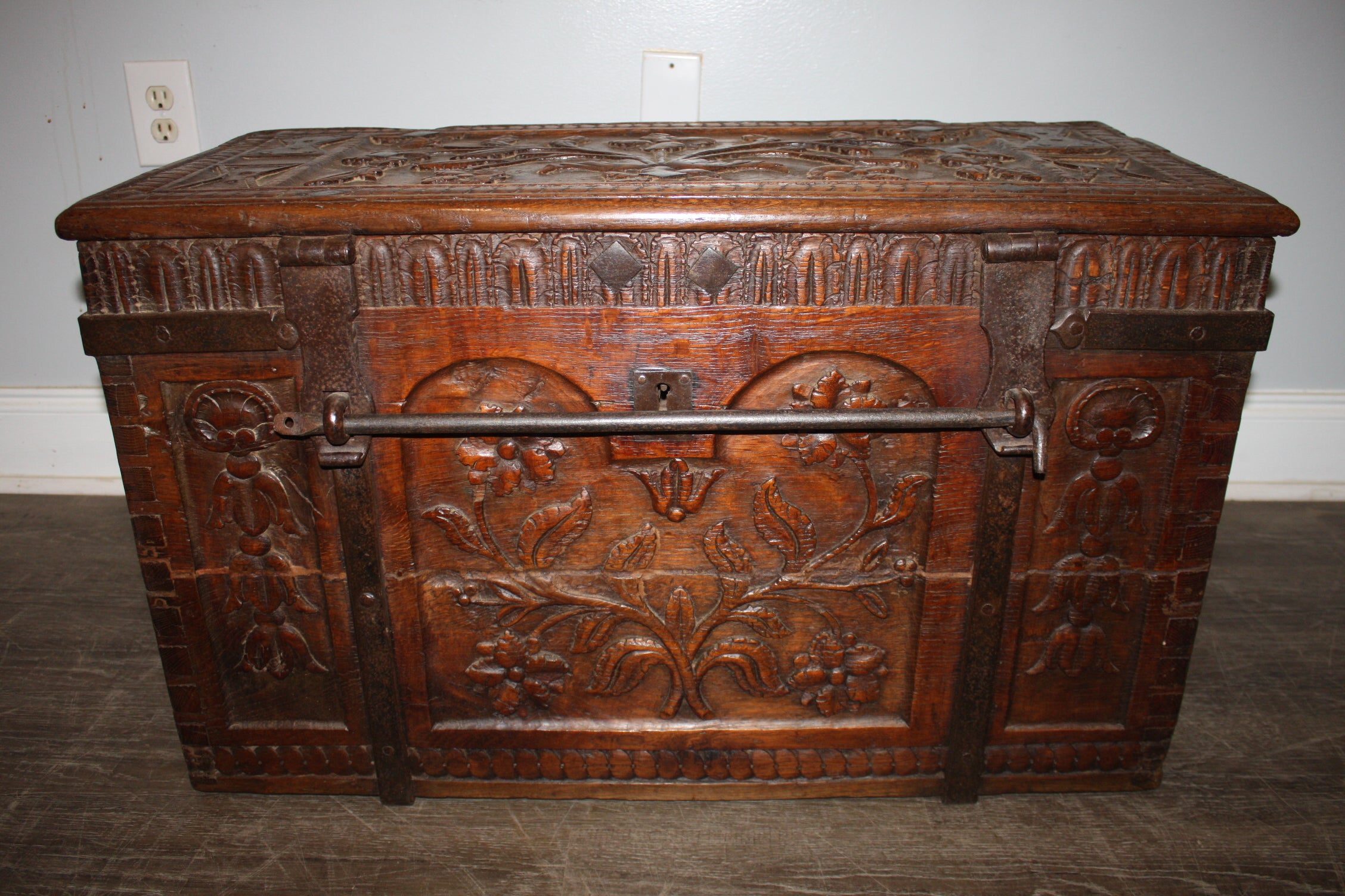 This magnificent trunk is rich on carvings and Iron, it has as well its original iron bar to lock it. Just beautiful