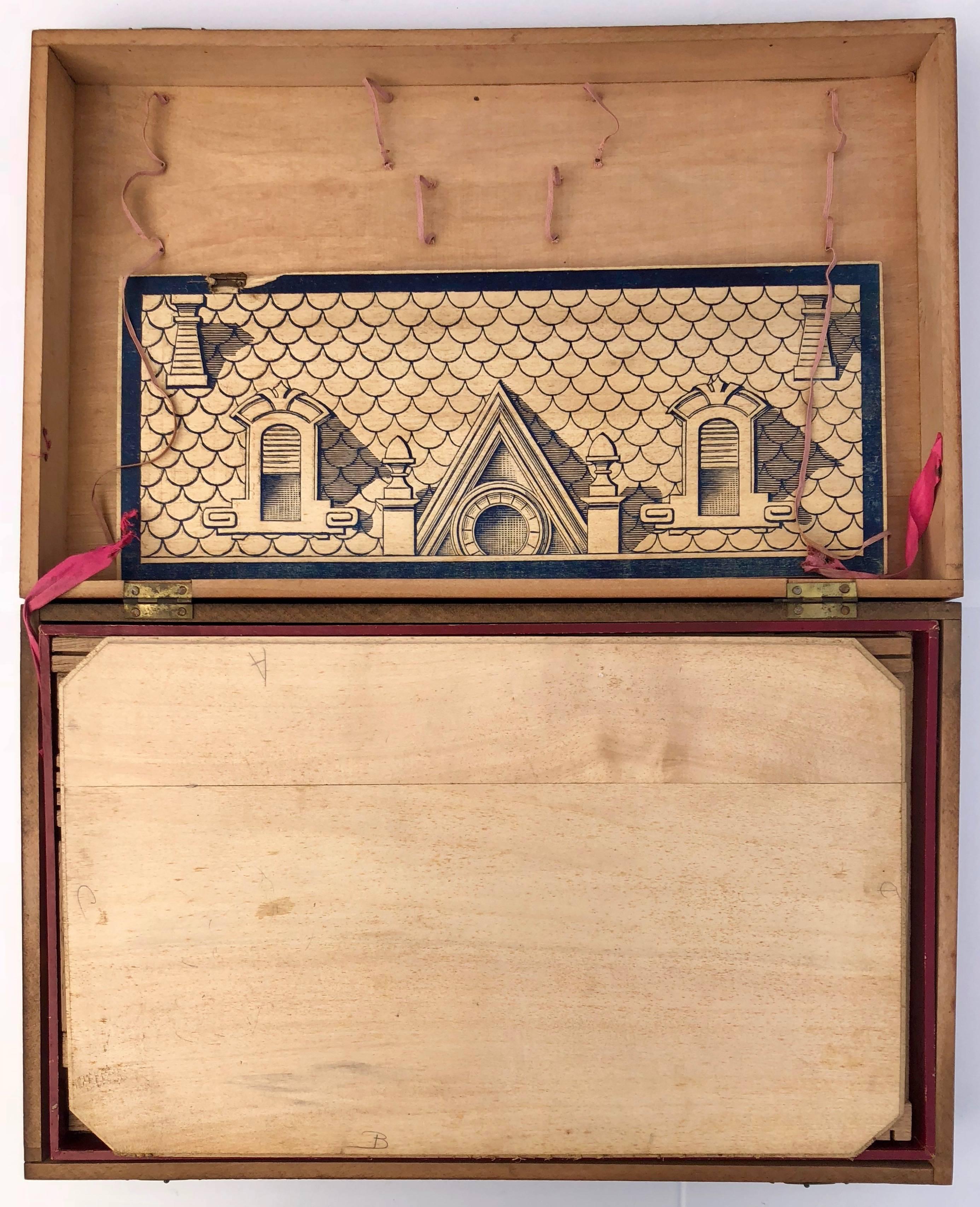 This is a French early 1900s wooden construction game wooden game with 3 drawers, 