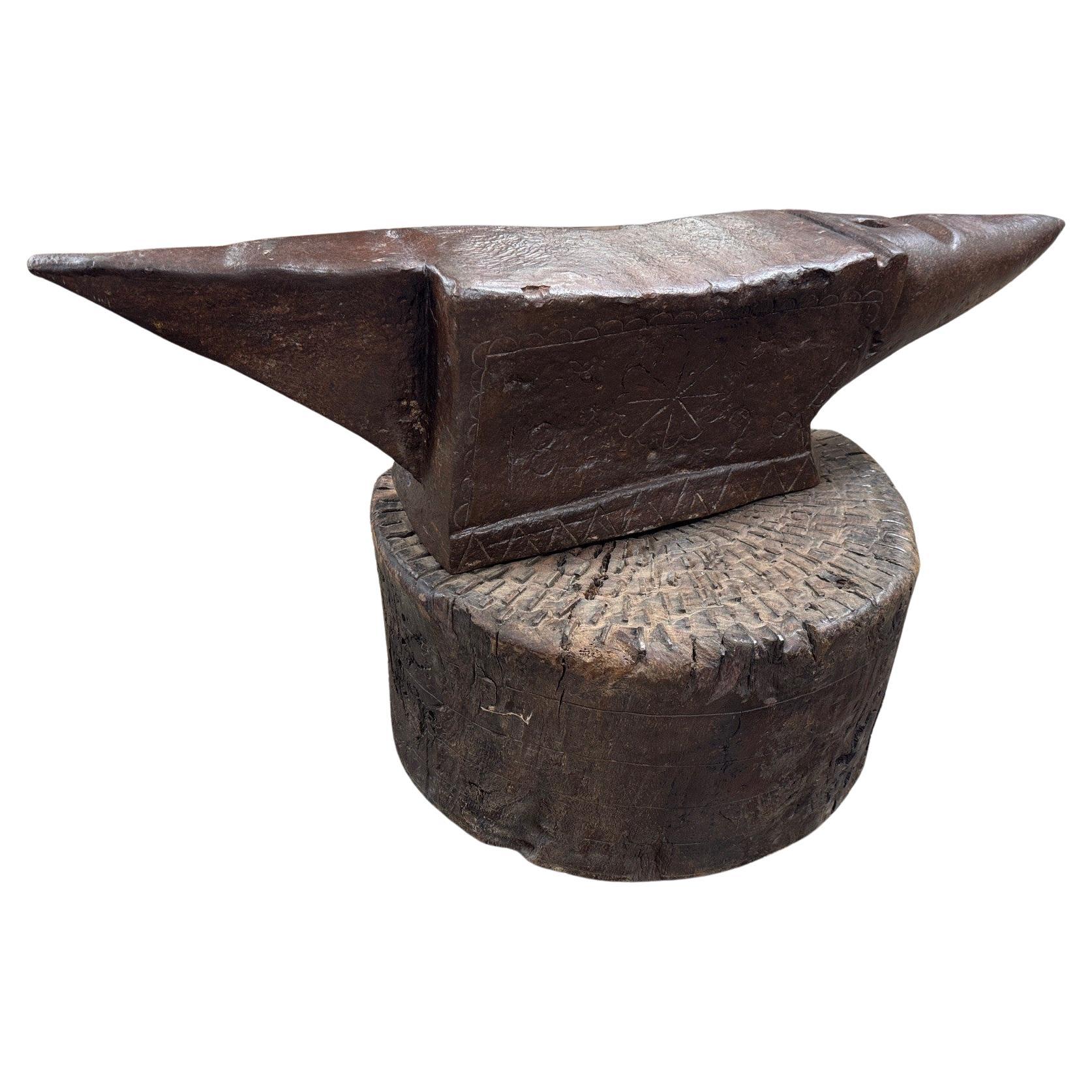 A very handsome early 19th century Enclume - Anvil from the South of France.  Beautifully crafted from iron resting in its walnut base.  The anvil is dated 1820.  The top surface of the base is embedded with many iron pieces.  A perfect cocktail