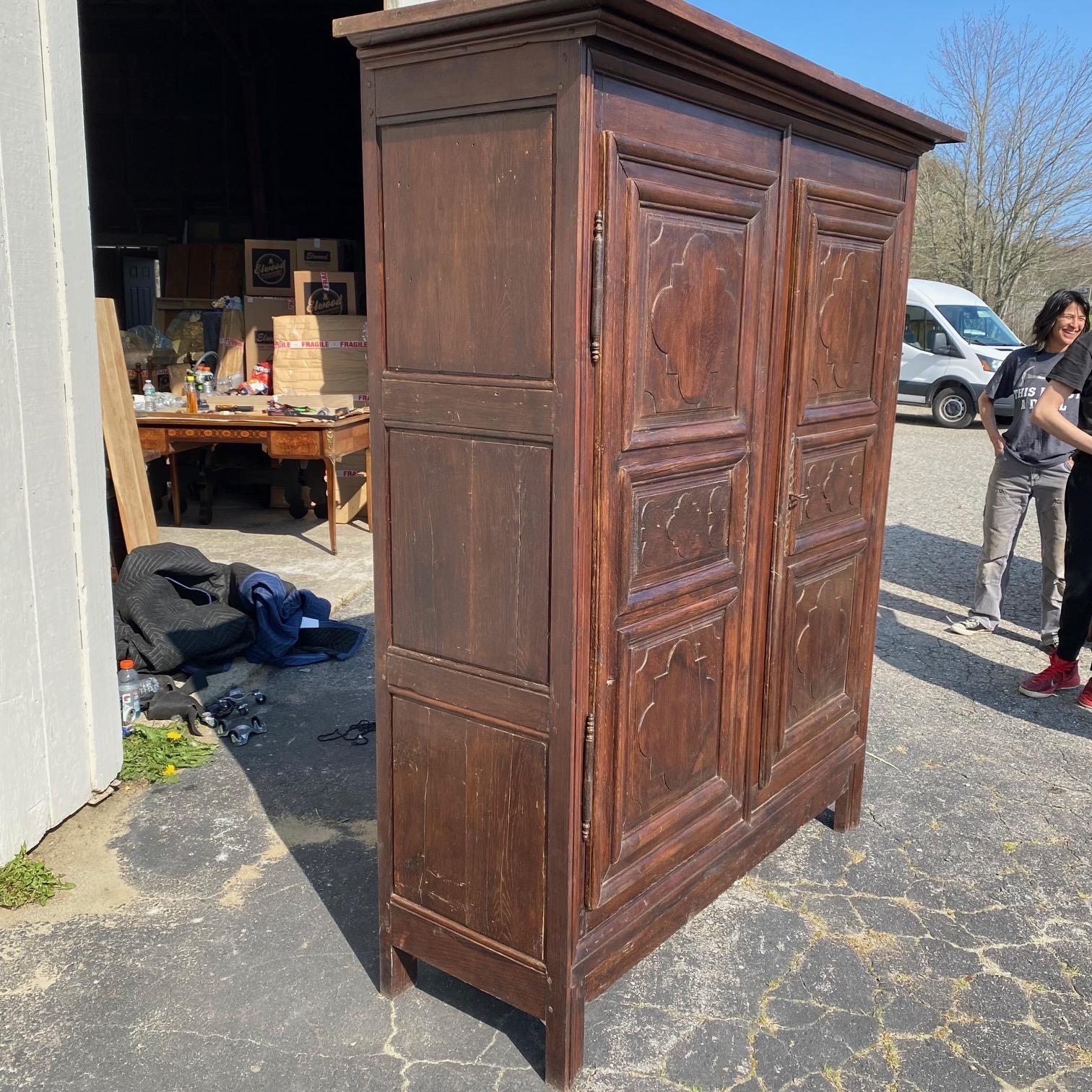 Really lovely carvings on this early 19th century oak armoire found in Normandy, France. Includes original key, and interior has three sections and two spacious drawers. Beautiful original brass escutcheons. Great patina and size!
#5952

