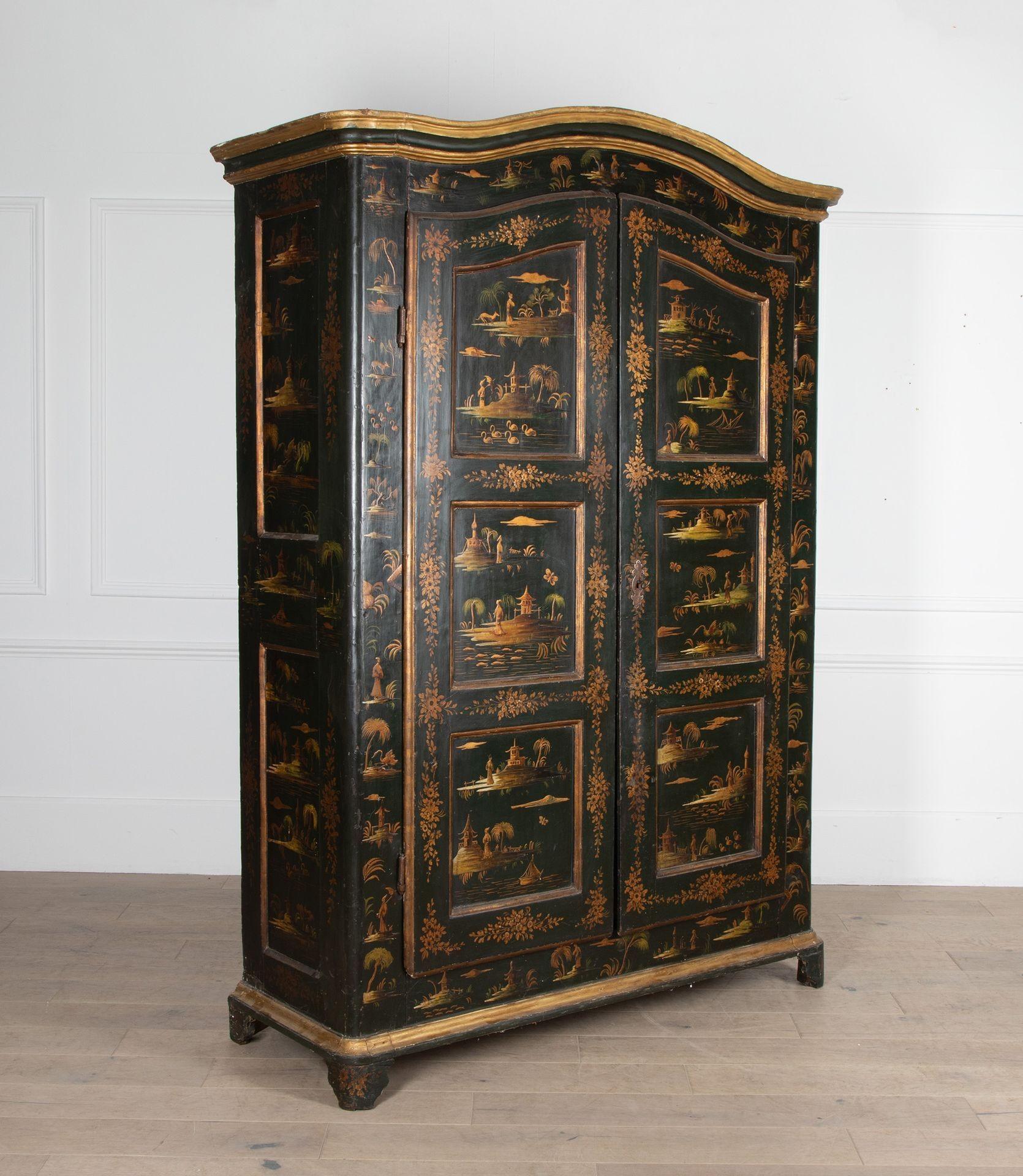 A beautiful and richly decorated French early 19th Century armoire in the Chinoiserie taste.
In its original green lacquer with gold decorative elements to all visible sides. Also retaining its original lining paper to the interior.