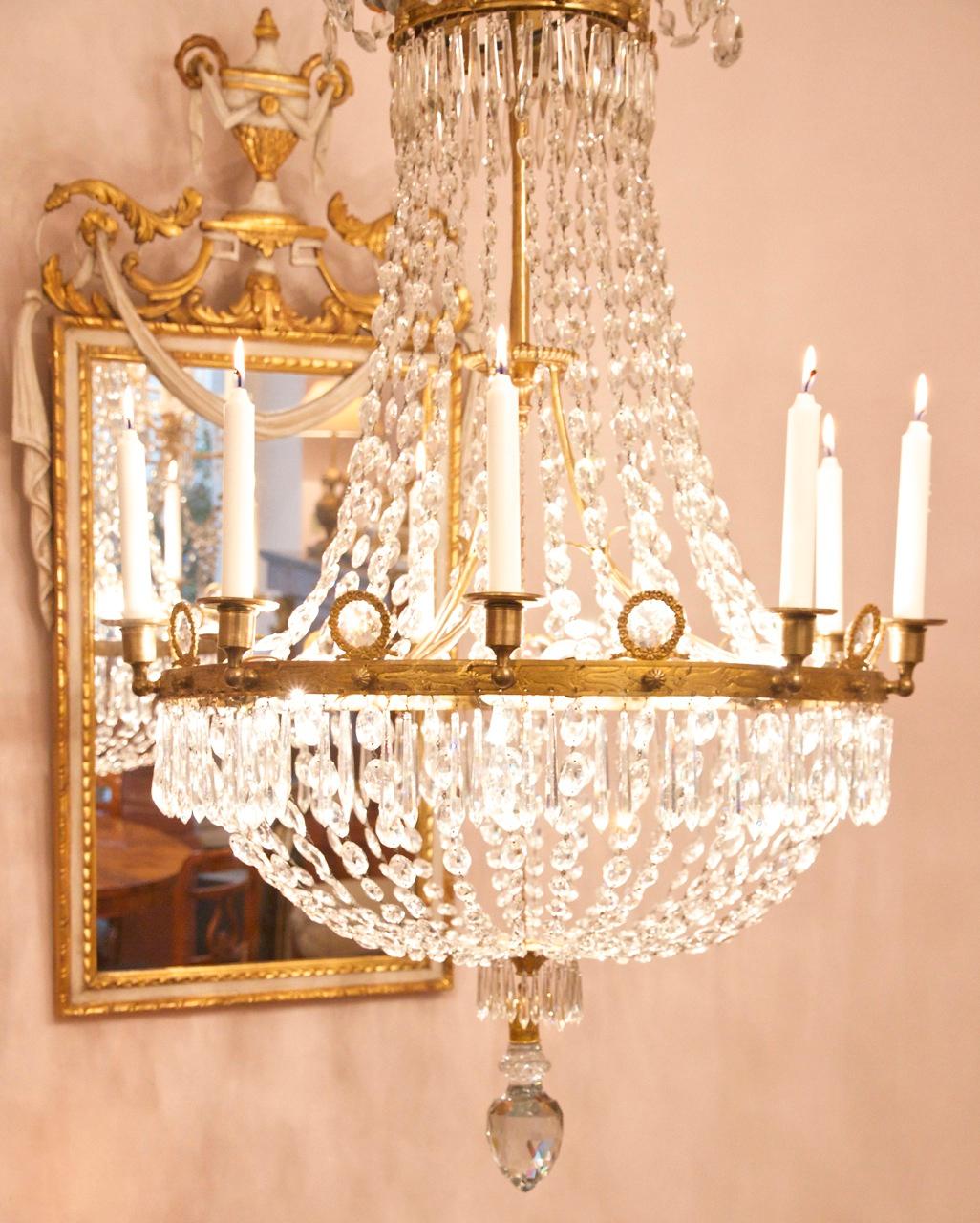 French Early 19th Century Empire Crystal-Cut and Gilt-Bronze Basket Chandelier

A finely proportioned Empire gilt bronze and crystal-cut nine light tent and bag Chandelier. With an anthemion cast corona suspending chains of graduated almond shaped