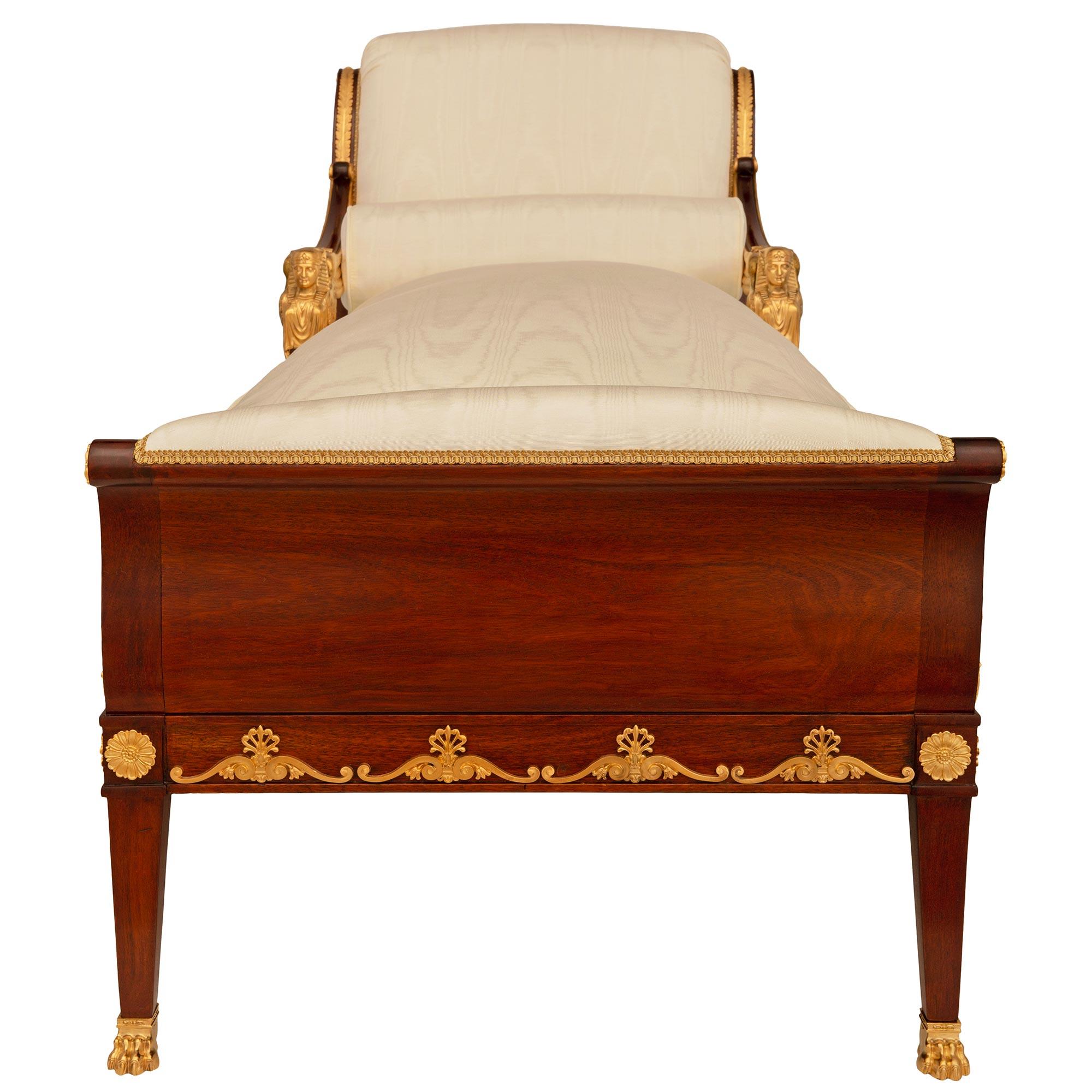 19th Century French early 19th century Empire period Mahogany and Ormolu chaise, Circa 1805 For Sale