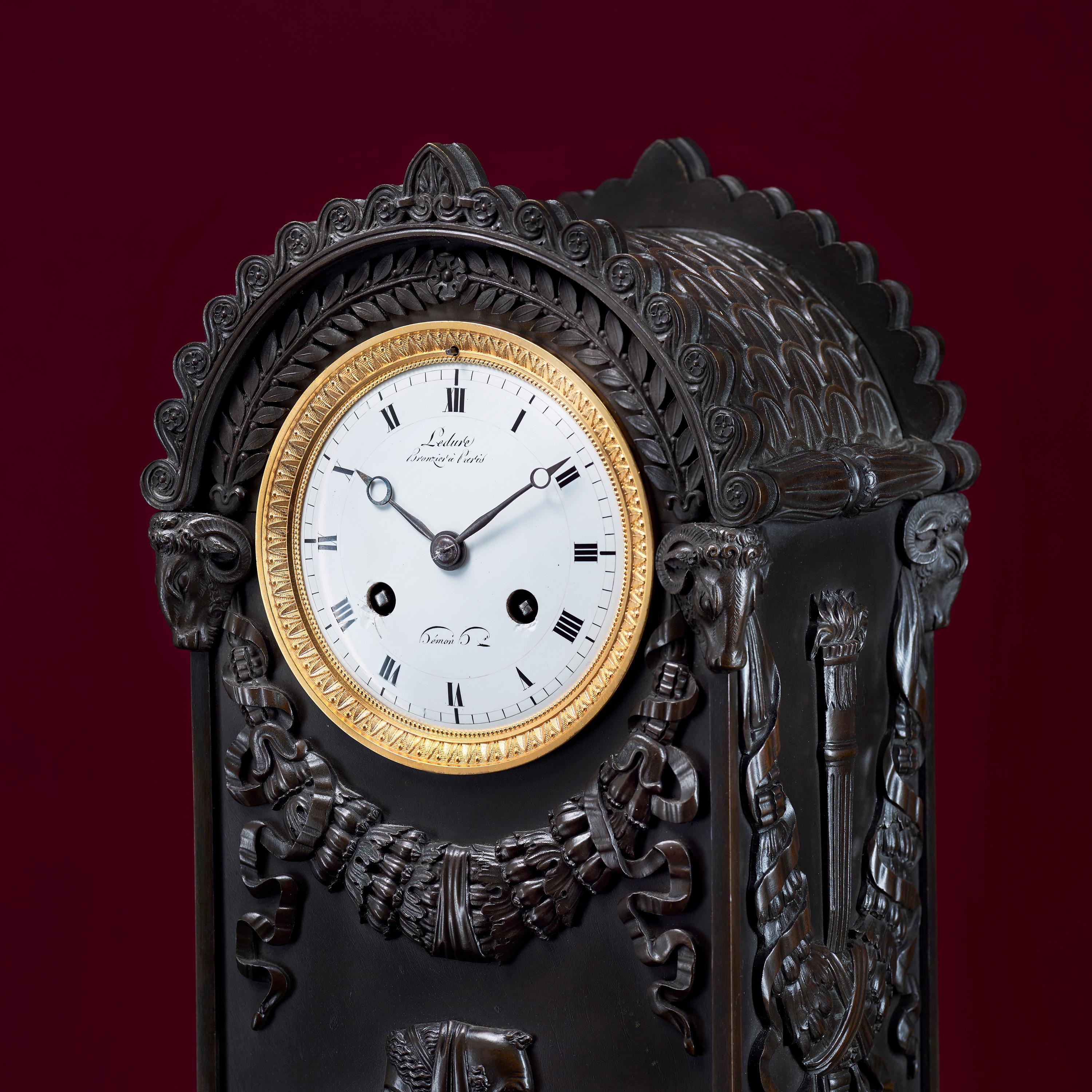 Very fine early 19th century Empire period mantel clock of patinated bronze. It is signed by one of the best Parisian bronzers Pierre Victor Ledure and his collaborating clockmaker Claude Hémon. The case of classical form with typical Empire