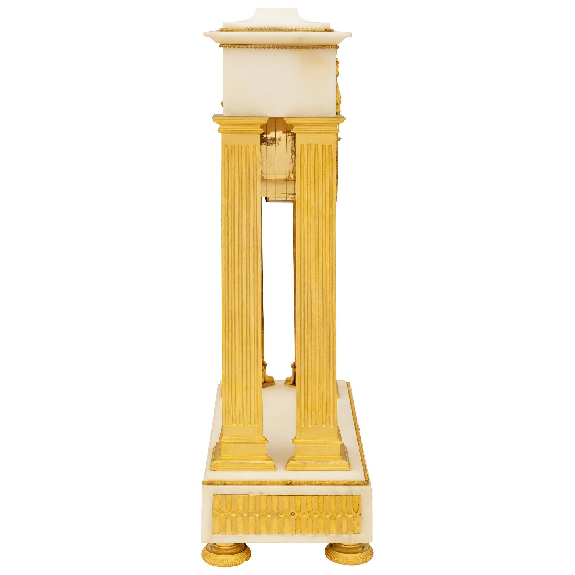 19th Century French early 19th century Empire st. white Carrara marble and Ormolu clock For Sale