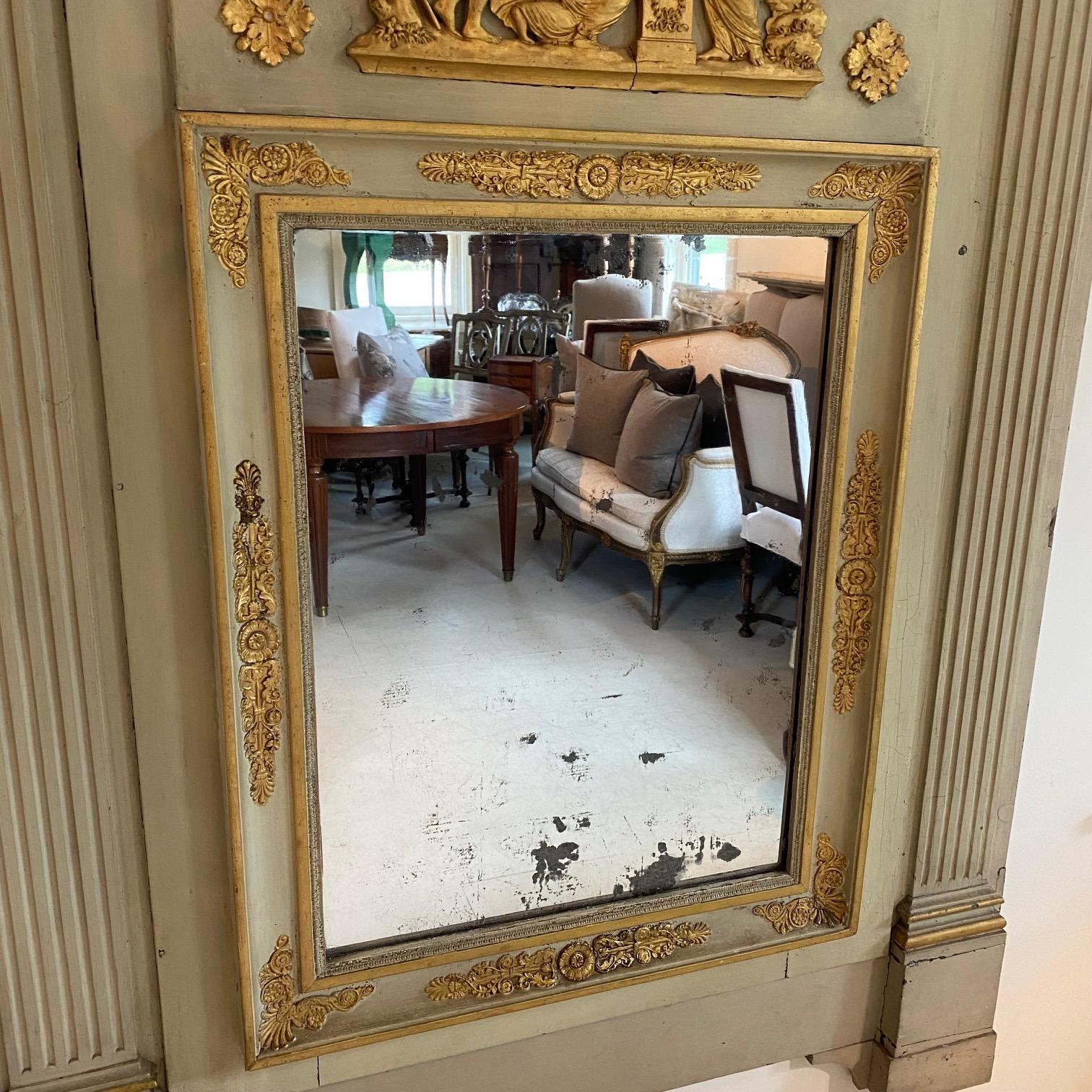 Louis XVI period trumeau mirror with celadon painted frame and figural pastoral scene in original gold gilt, circa 1800. Original mercury glass mirror.
Inside mirror 25.5 H 19 W
#5842.