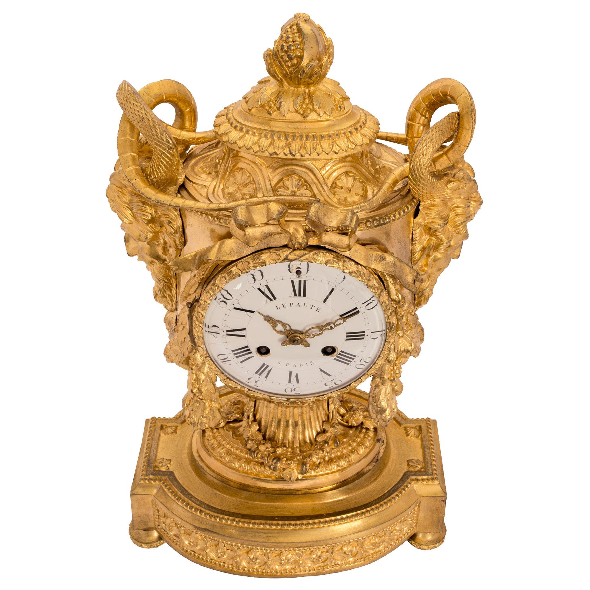 An extremely high quality French mid 19th century Louis XVI st. signed 'Lepaute, Paris' ormolu clock. The clock with a superb chasing throughout has all of its original gilt. Raised by an oval back base and topie shaped legs has rosettes and a