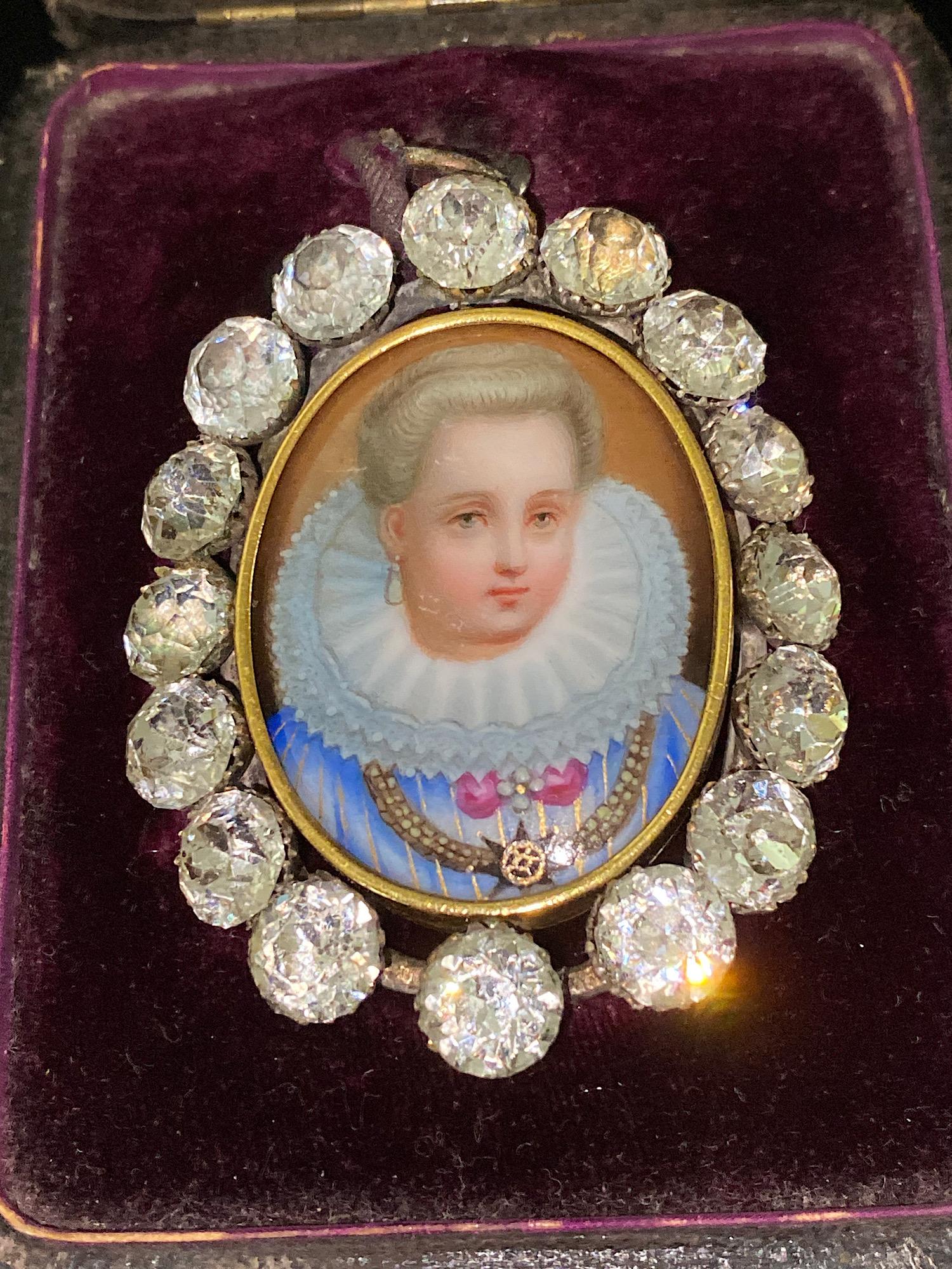 A fine 19th. century French Paste & Porcelain portrait pendant.

The central Rennaisance style portrait of a noblewoman is finely hand painted on an oval porcelain plaque. The portrait of the beautiful Rennaisance Lady shows the stunning jewellery 
