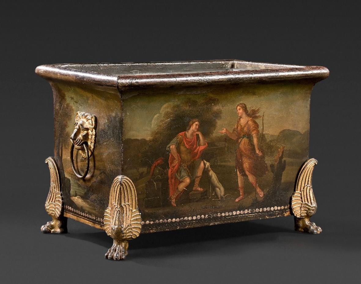 A rare and very decorative French Empire tôle peinte ormolu-mounted jardiniere or planter of rectangular form dating from circa 1800. Very fine painted decor to all sides: the two long sides with figurative scenes taken from the epic poem Jerusalem