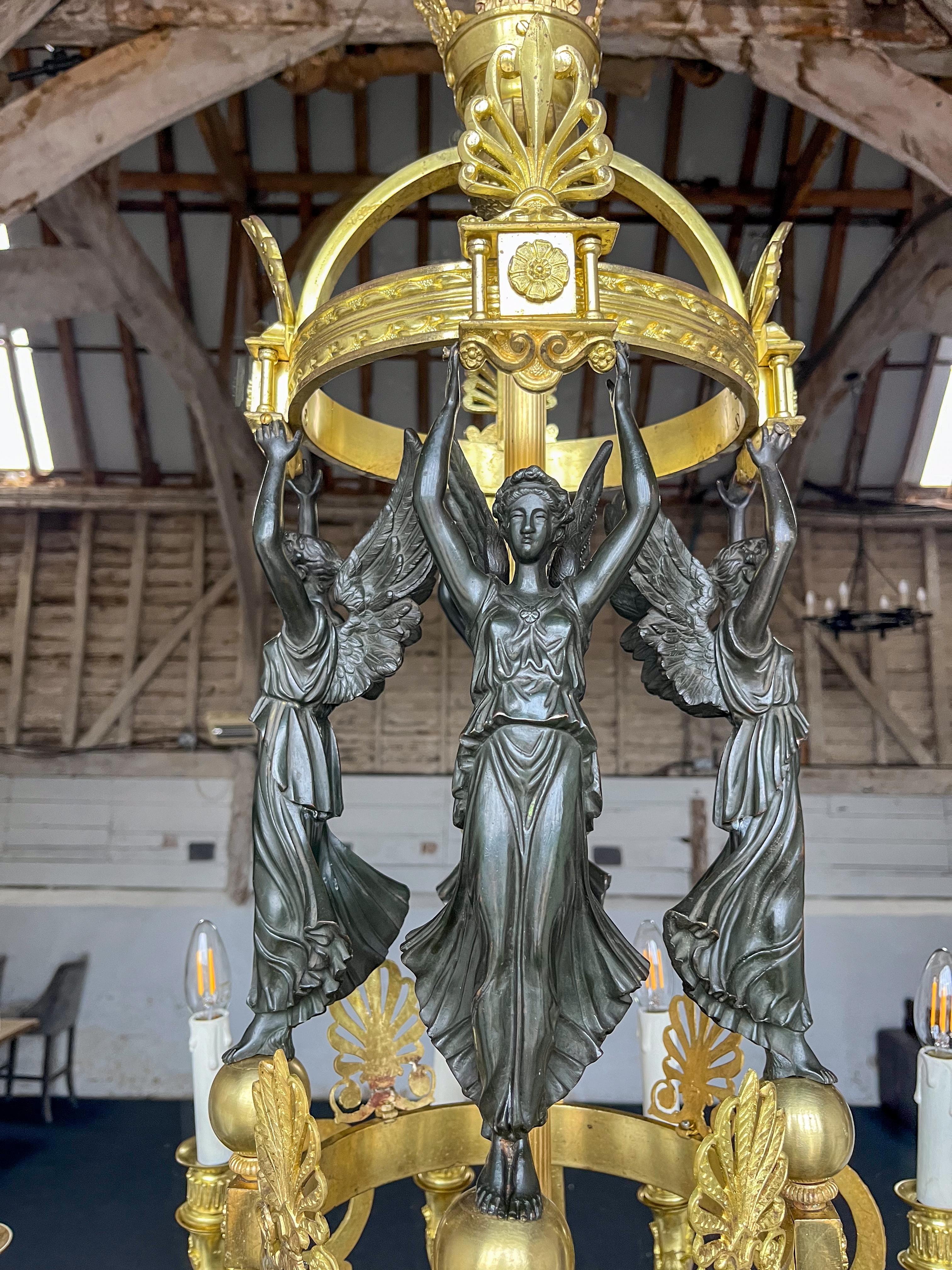 Ormolu  French early 19th Century twelve light gilded chandelier attributed to Thomire For Sale