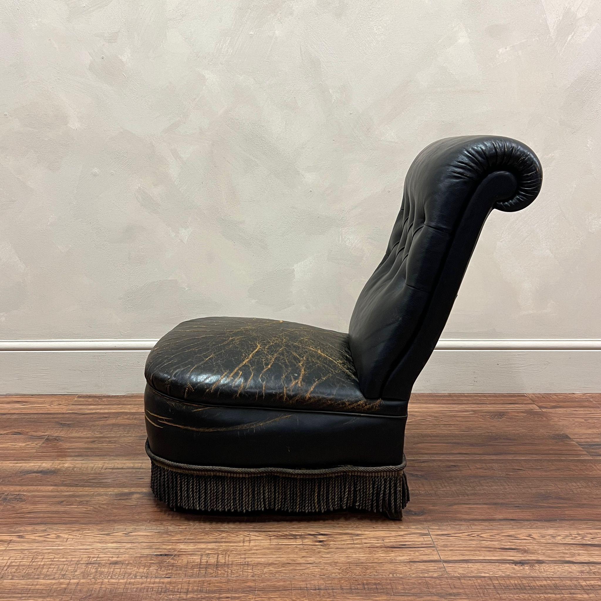 The wear on this wonderful French Leather Slipper Chair is exceptonal, no rips or tears just an amazing surface wear to the leather.
Original tassles to the bottom of the seat.

France, circa 1900

Back Height - 77cm
Width - 52cm
Depth - 70cm
Seat